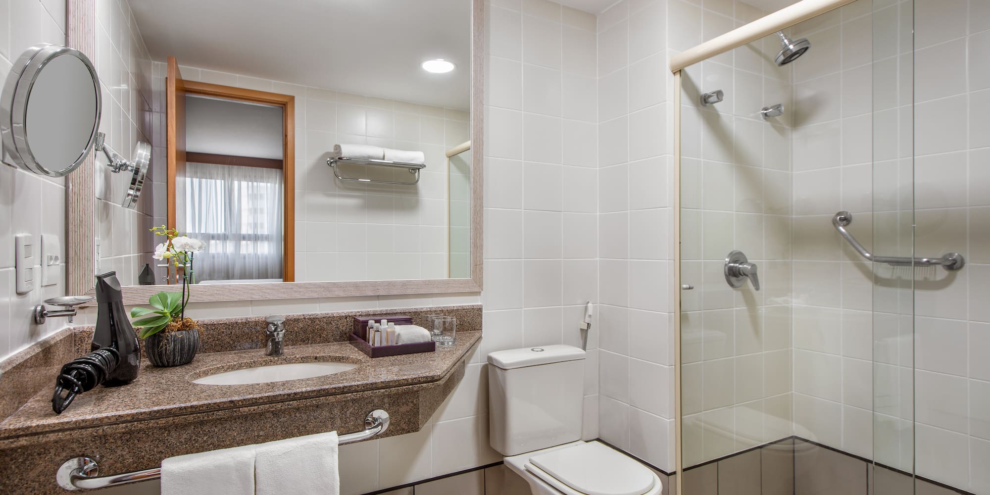 a bathroom with a shower and toilet
