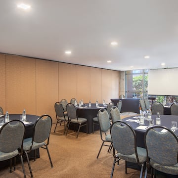 a room with round tables and chairs