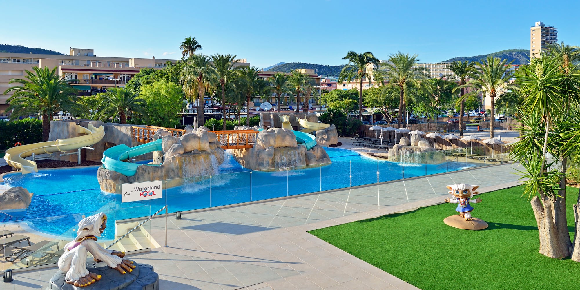 a water park with a slide and a playground