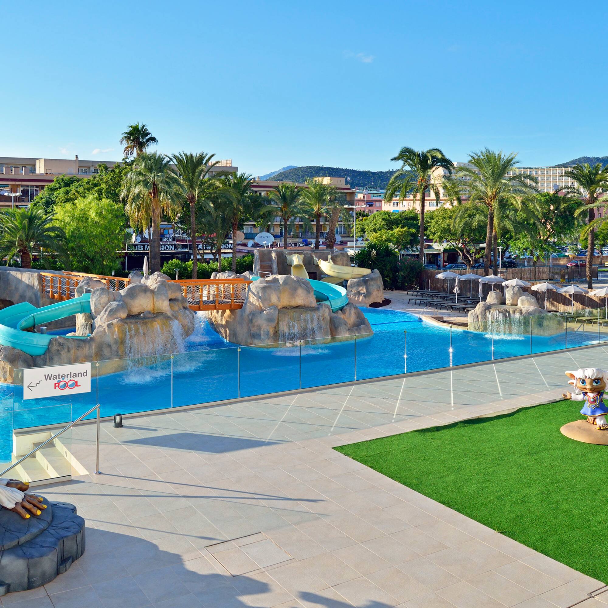 a water park with a slide and a playground