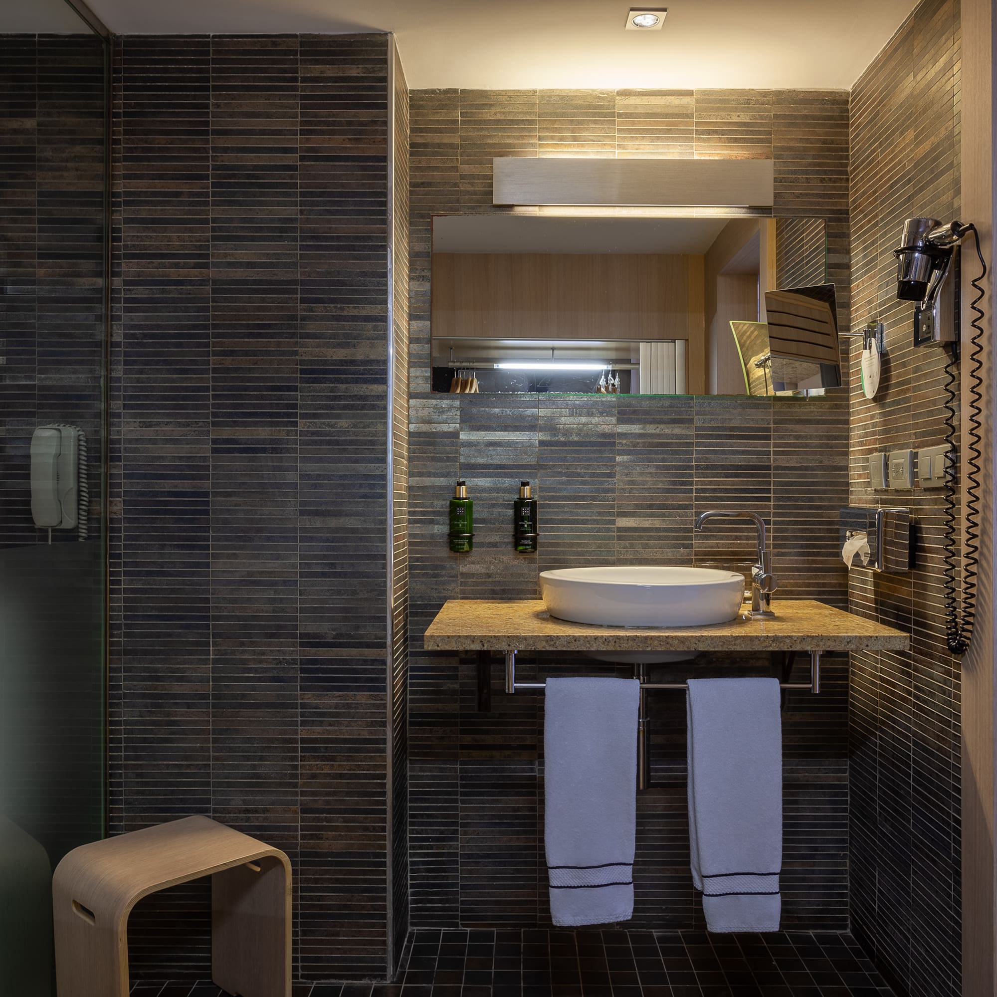 a bathroom with a sink and a shower