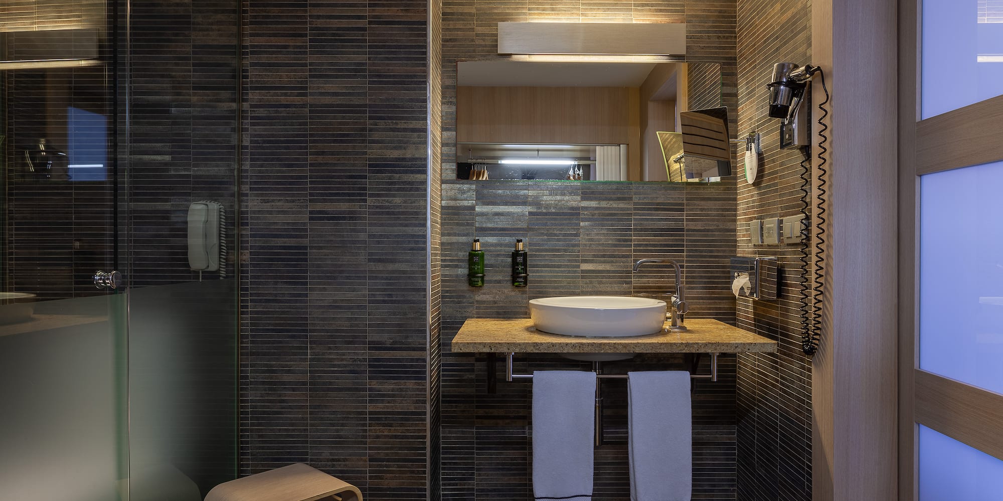 a bathroom with a sink and a shower