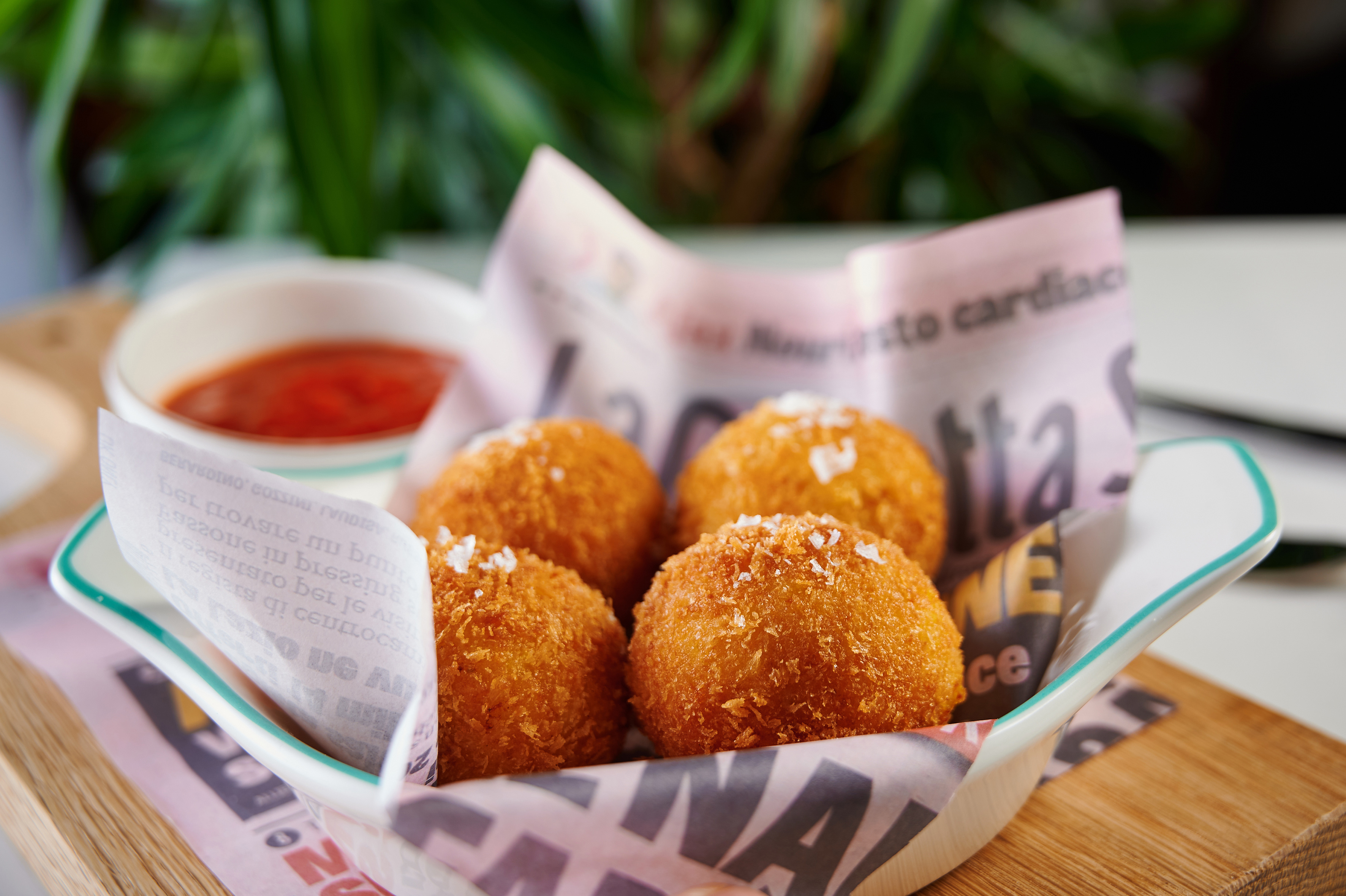 Crispy golden fried arancini with salt flakes, served with marinara sauce.