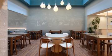 a room with tables and chairs