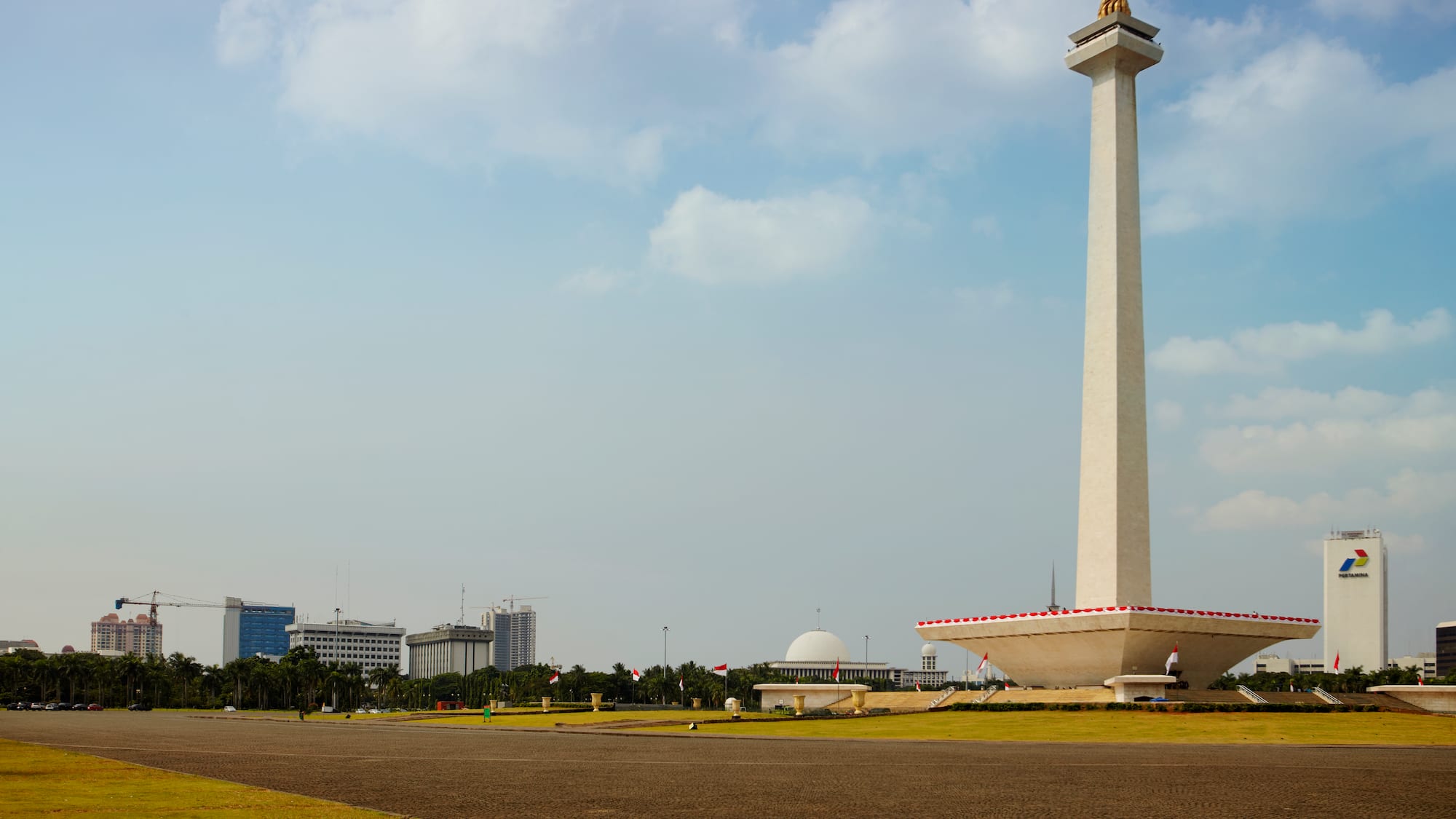 a large white tower with a gold top