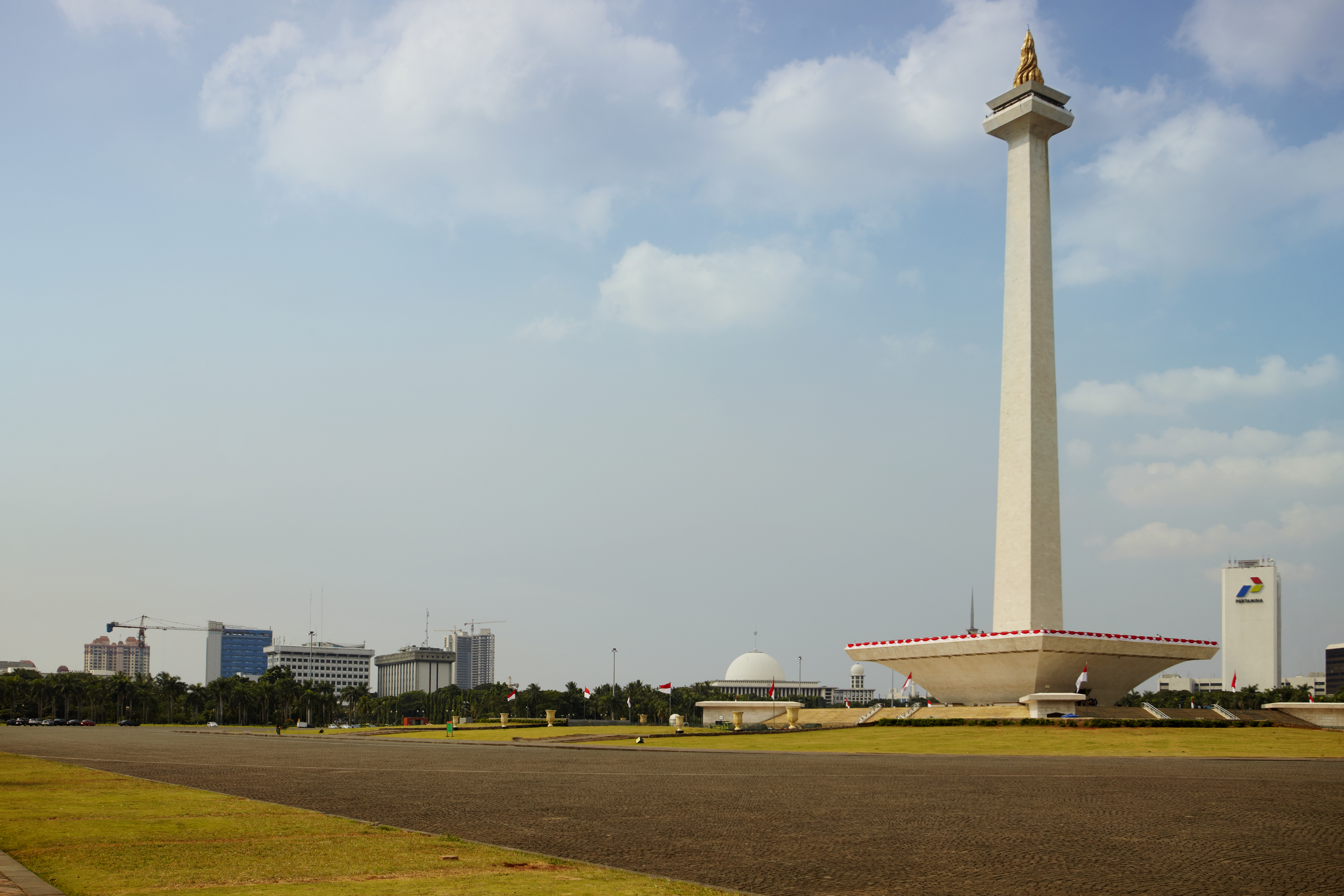 a large white tower with a gold top