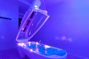 a bathtub with a purple light
