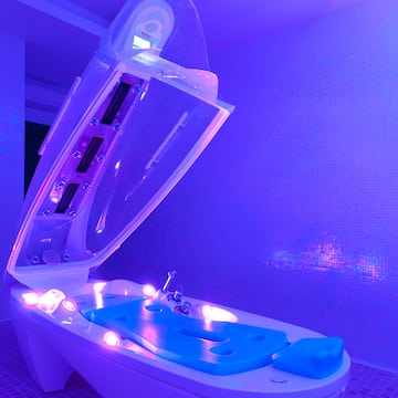 a bathtub with a purple light