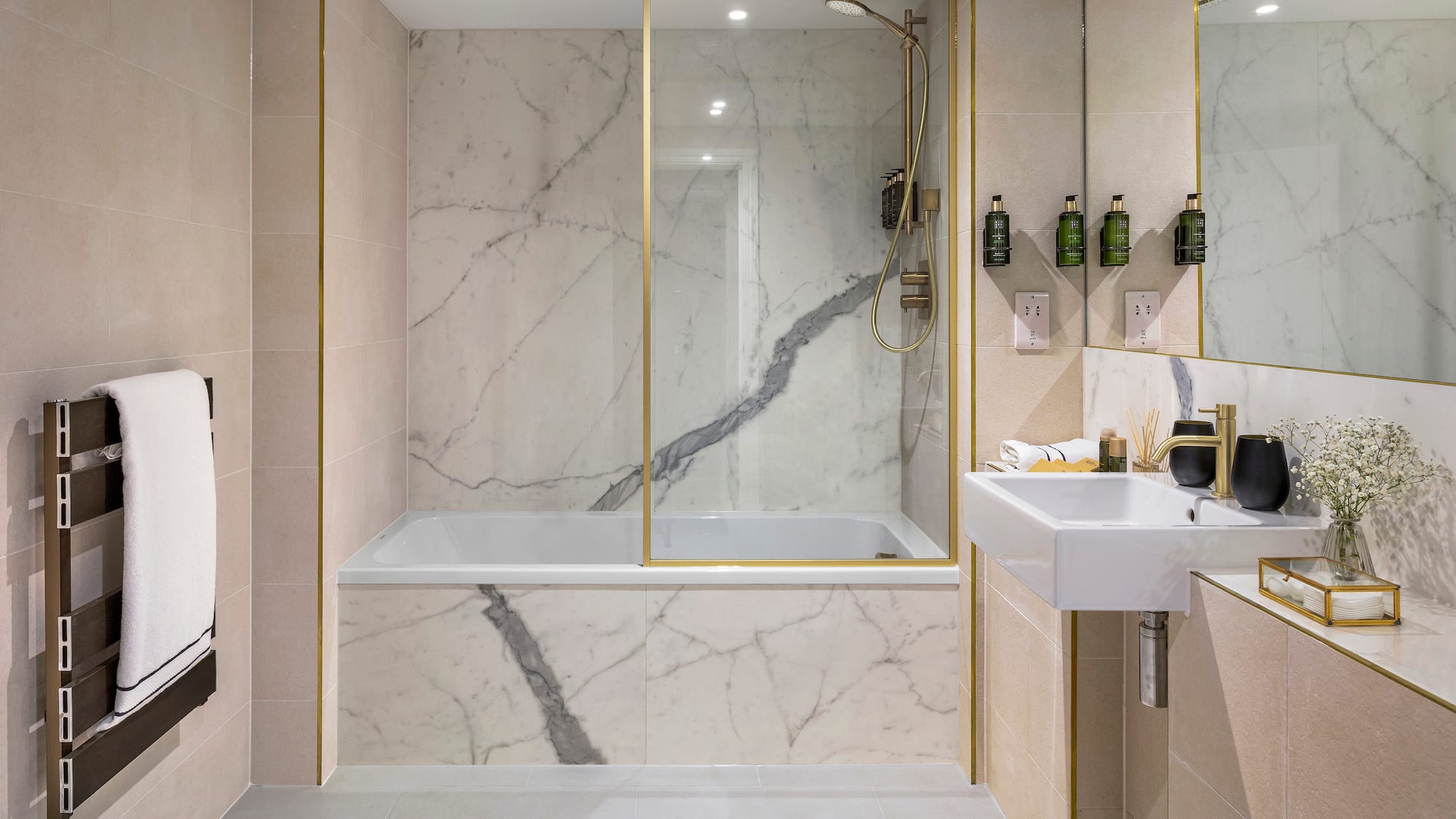 a bathroom with marble walls and a bathtub