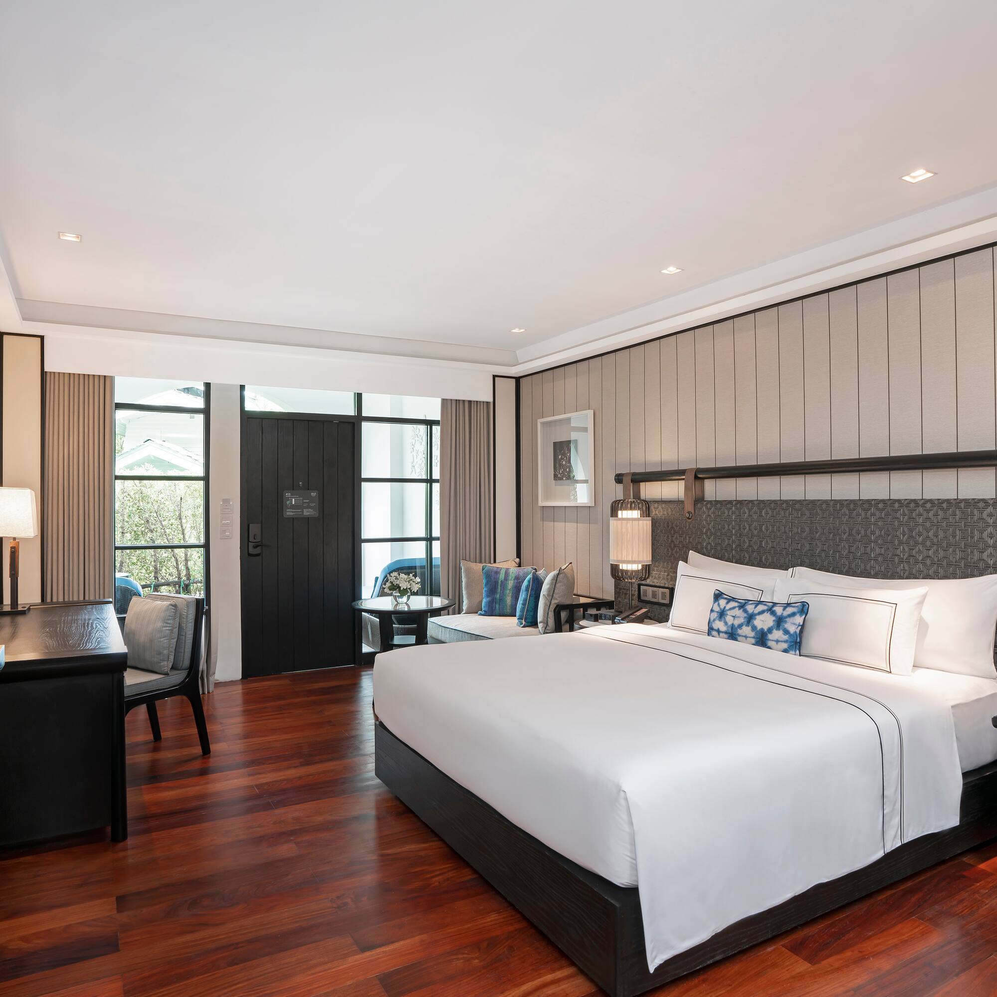 a bedroom with a bed and a desk