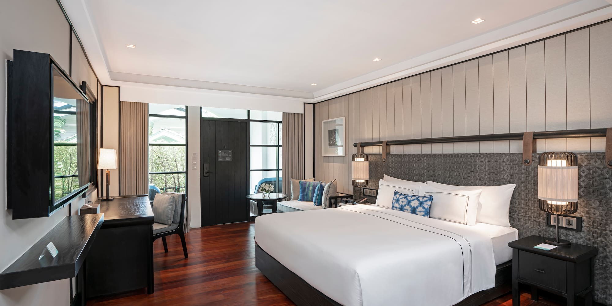 a bedroom with a bed and a desk