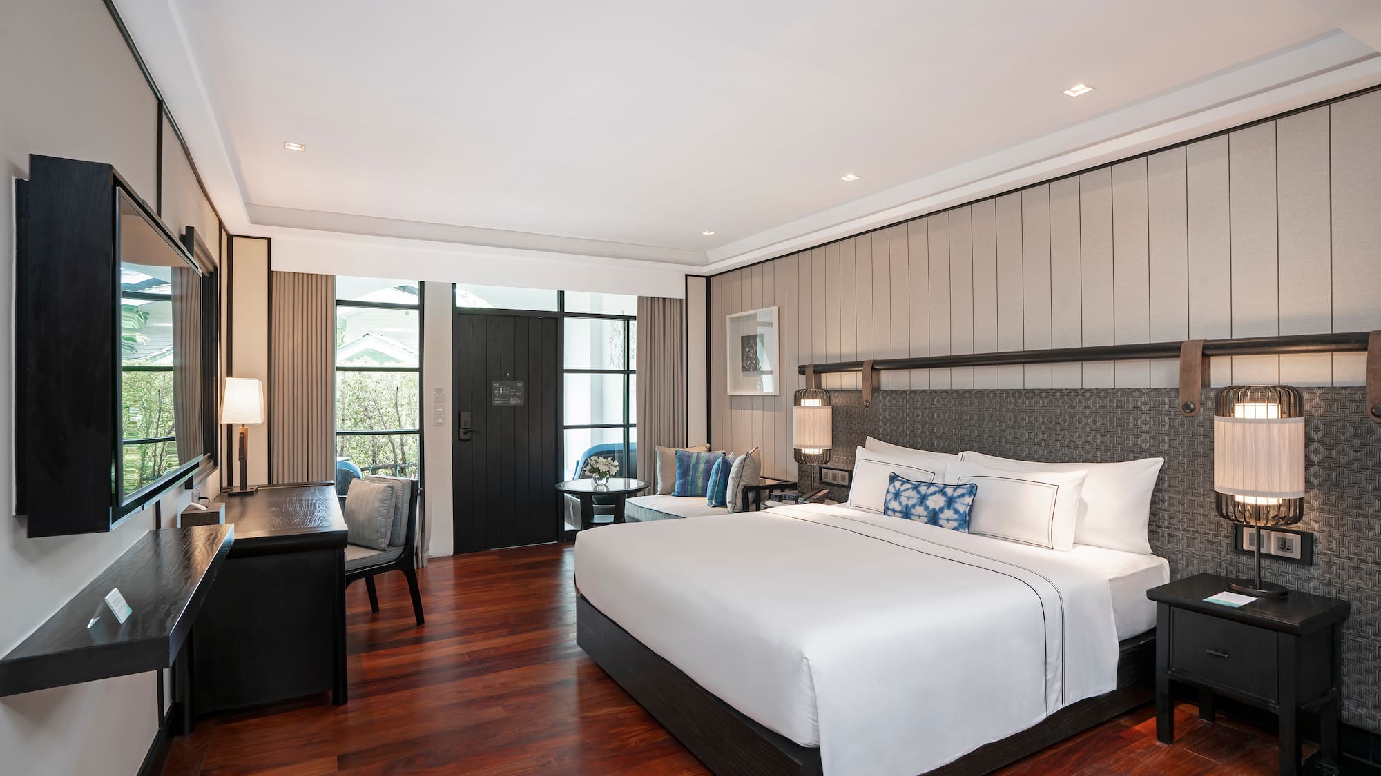 a bedroom with a bed and a desk