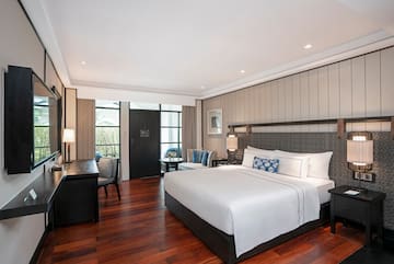 a bedroom with a bed and a desk