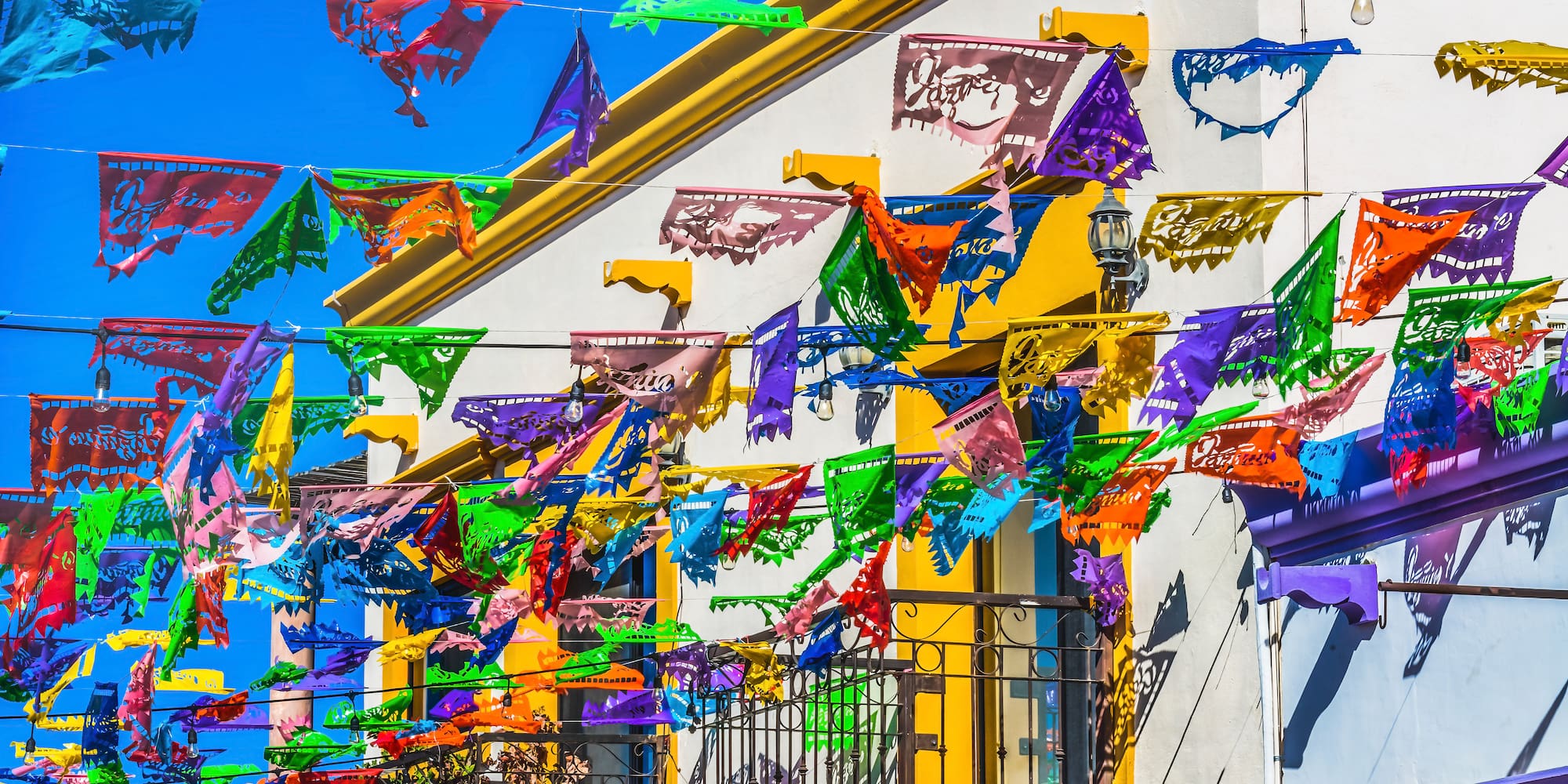 a colorful flags on a building