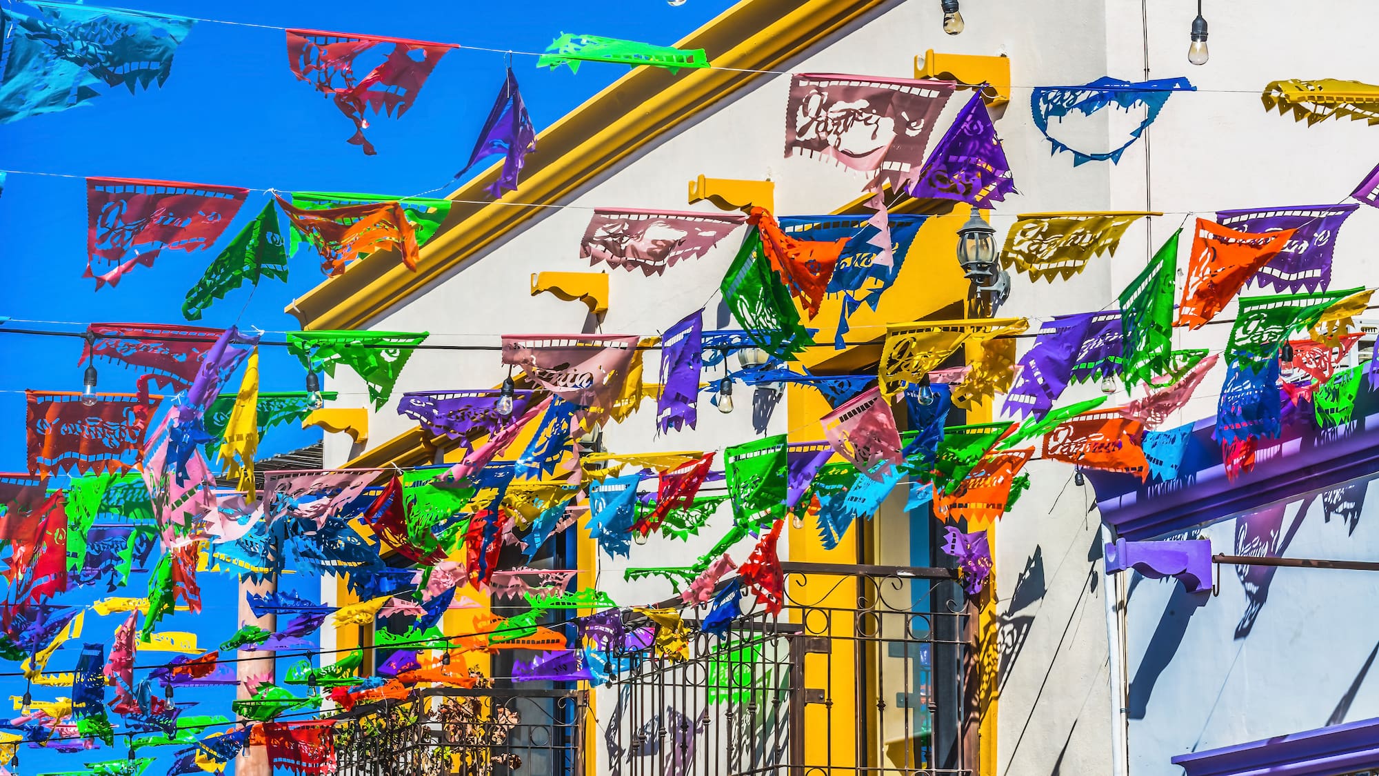 a colorful flags on a building