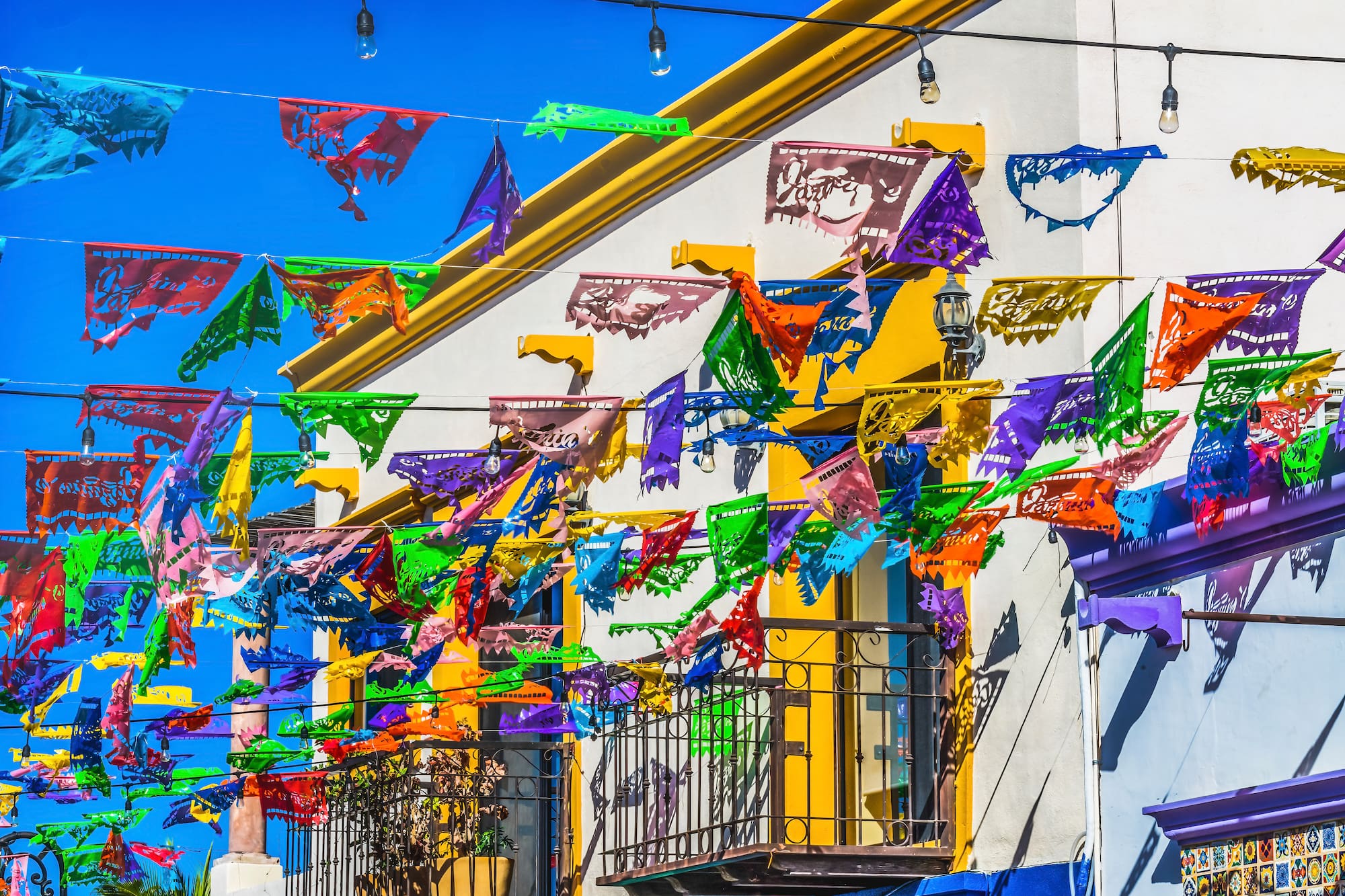 a colorful flags on a building