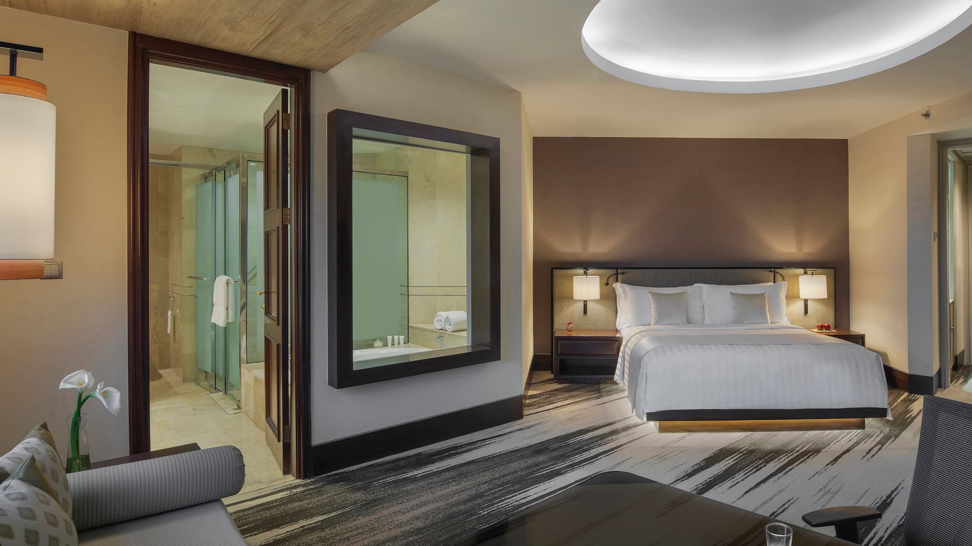 a room with a bed and a mirror