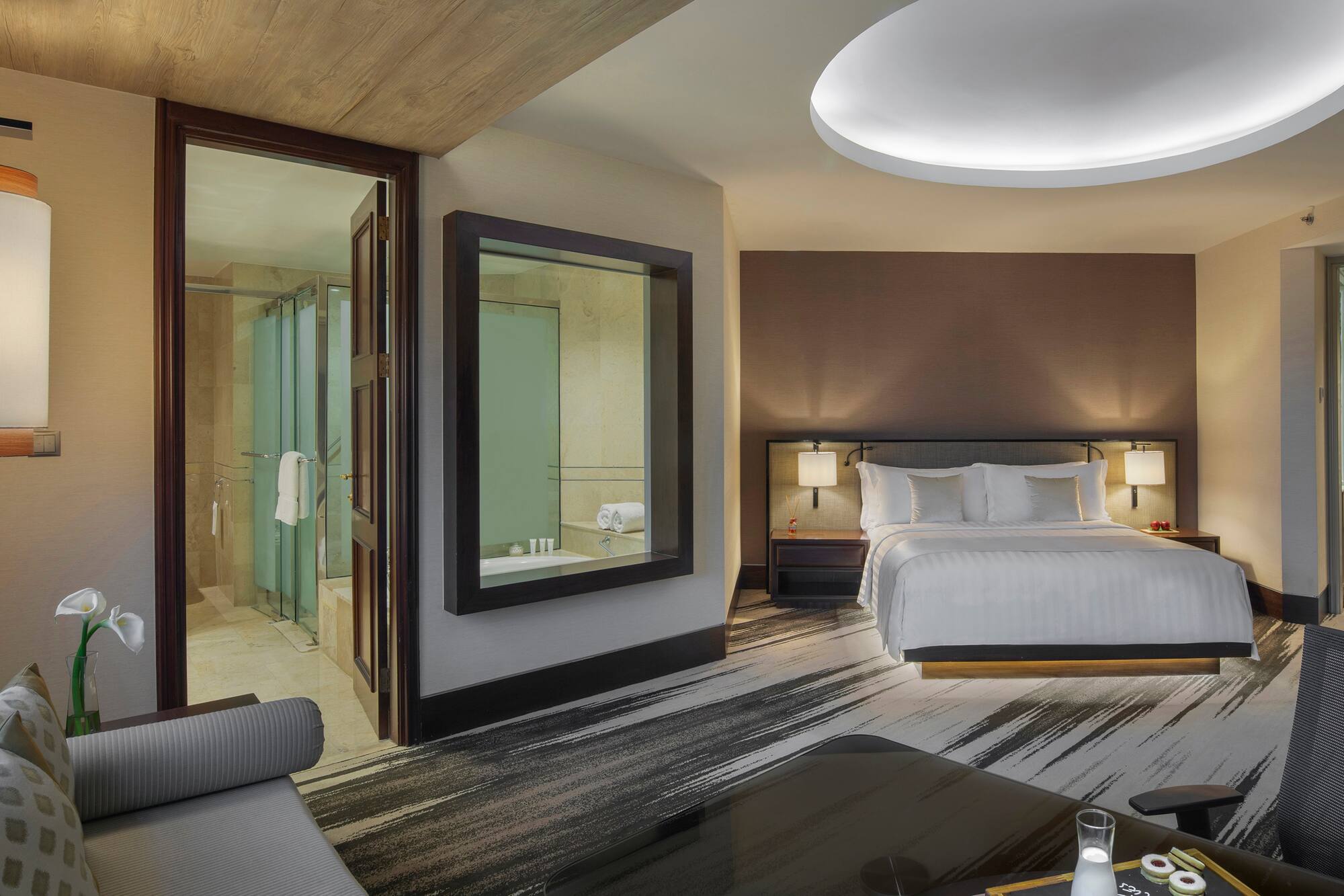 a room with a bed and a mirror