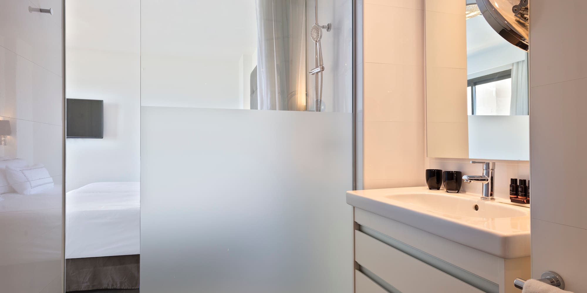 a bathroom with a glass shower door