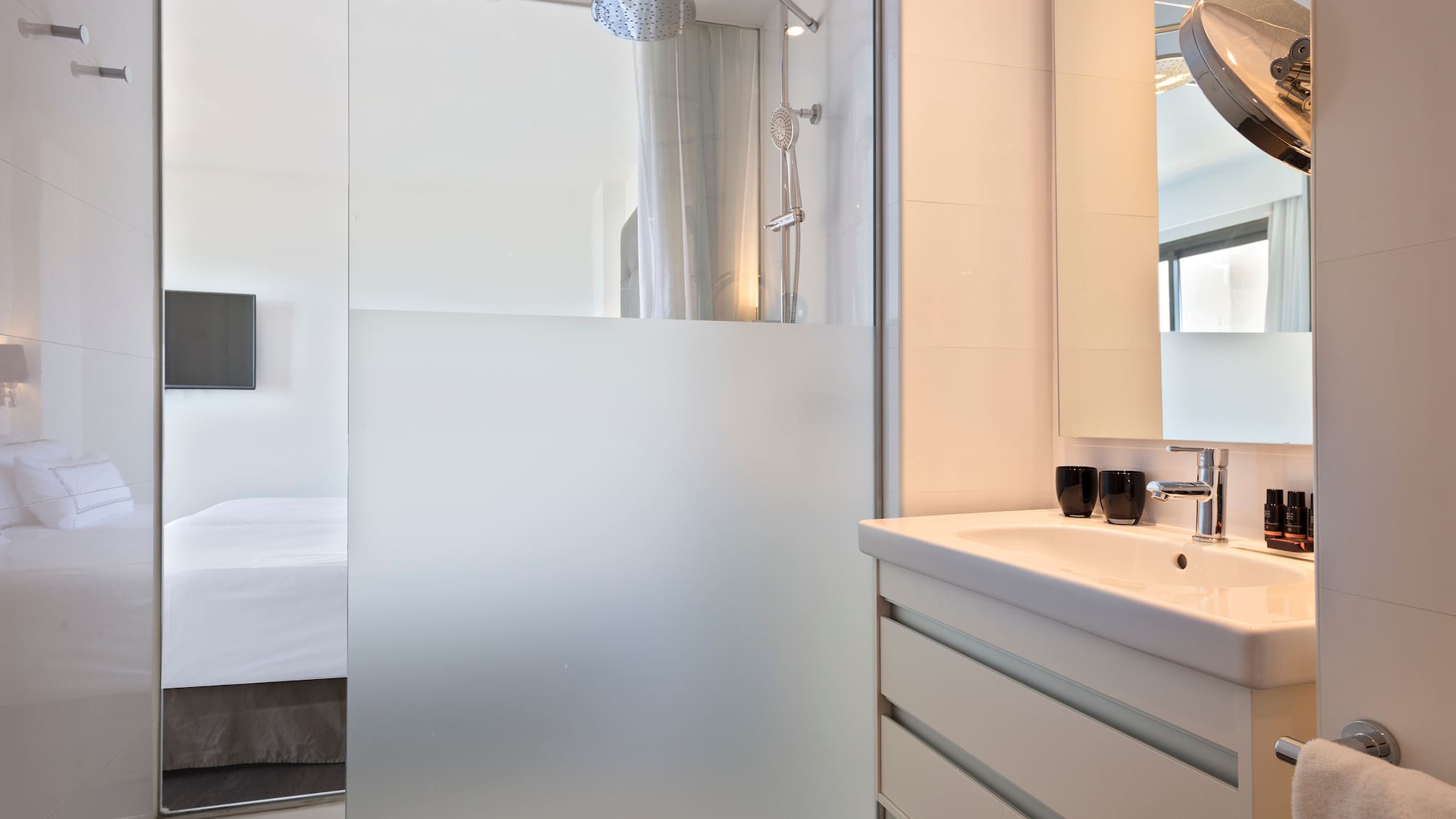 a bathroom with a glass shower door