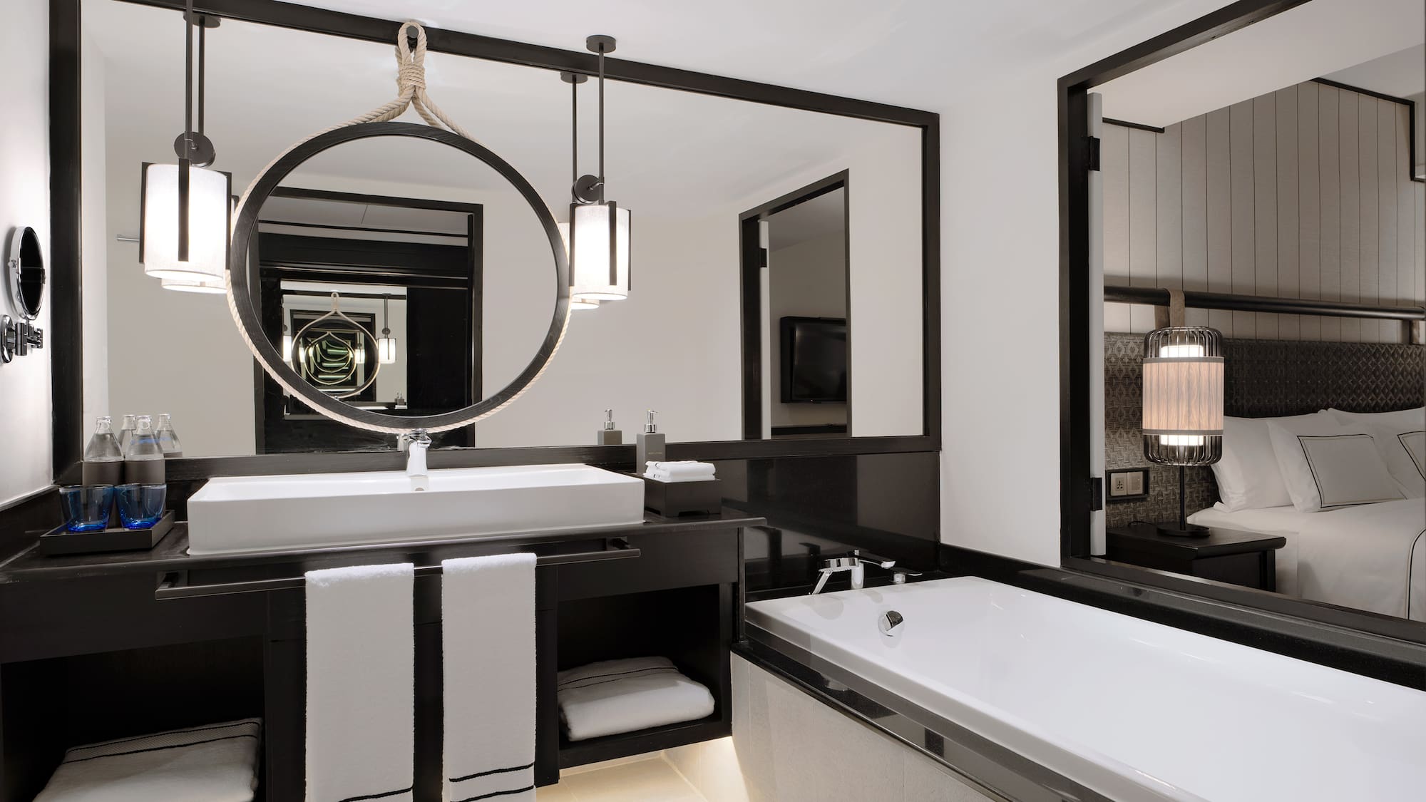 a bathroom with a large mirror and a bathtub