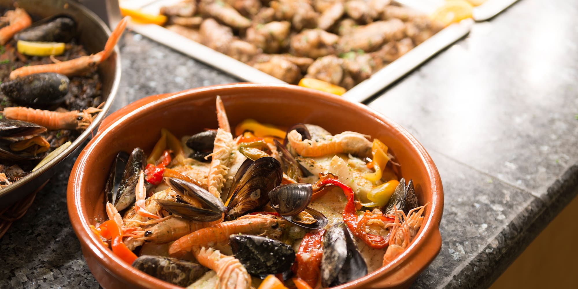 a bowl of seafood on a counter