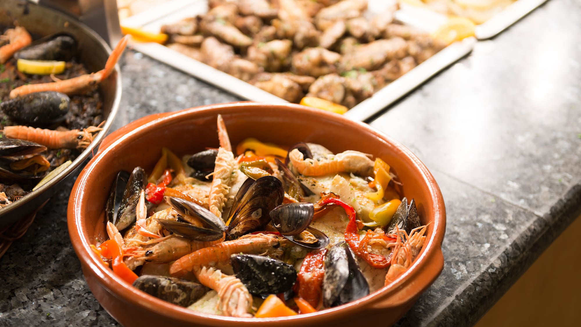a bowl of seafood on a counter