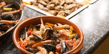 a bowl of seafood on a counter