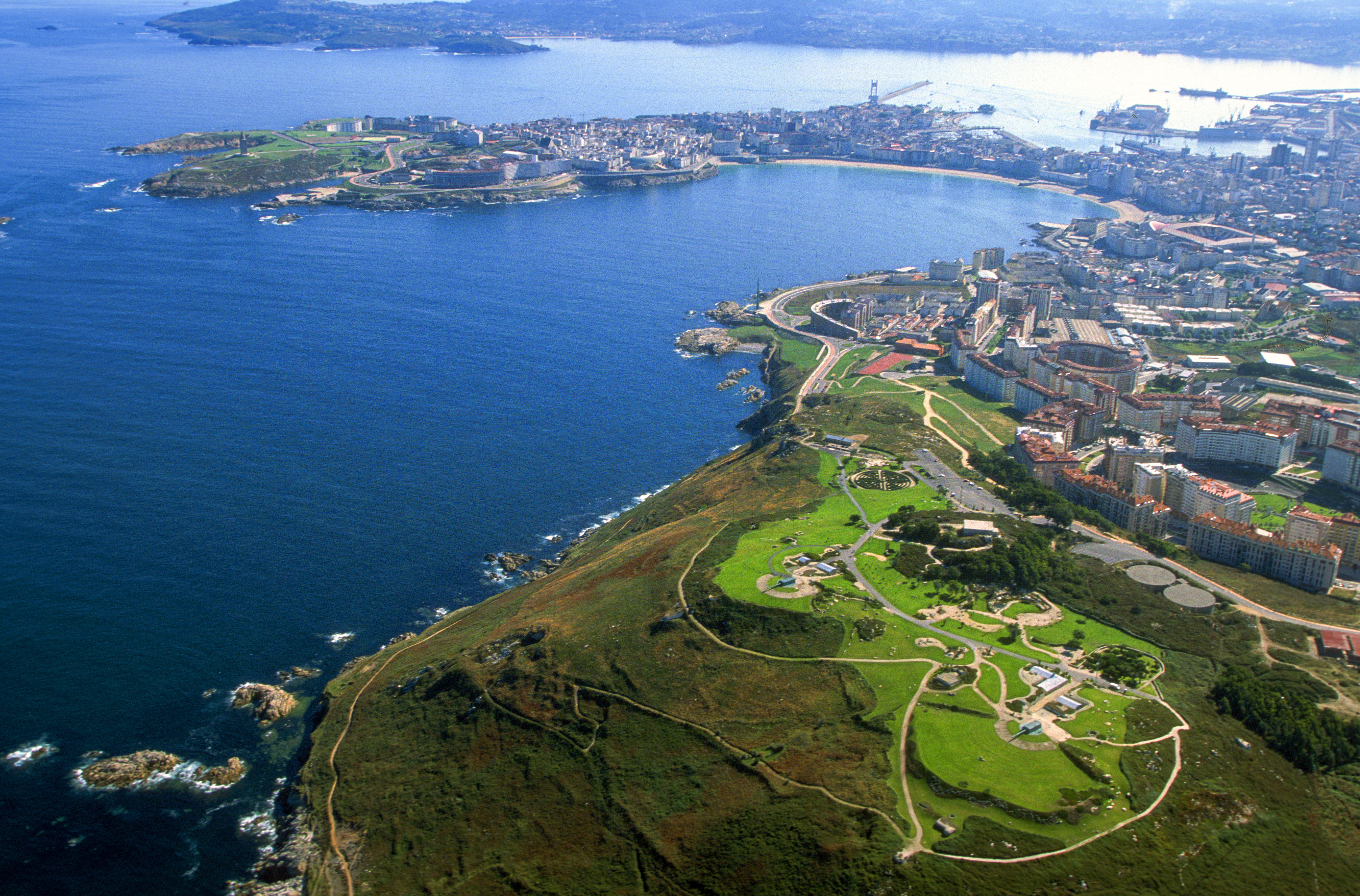 an aerial view of a city and water