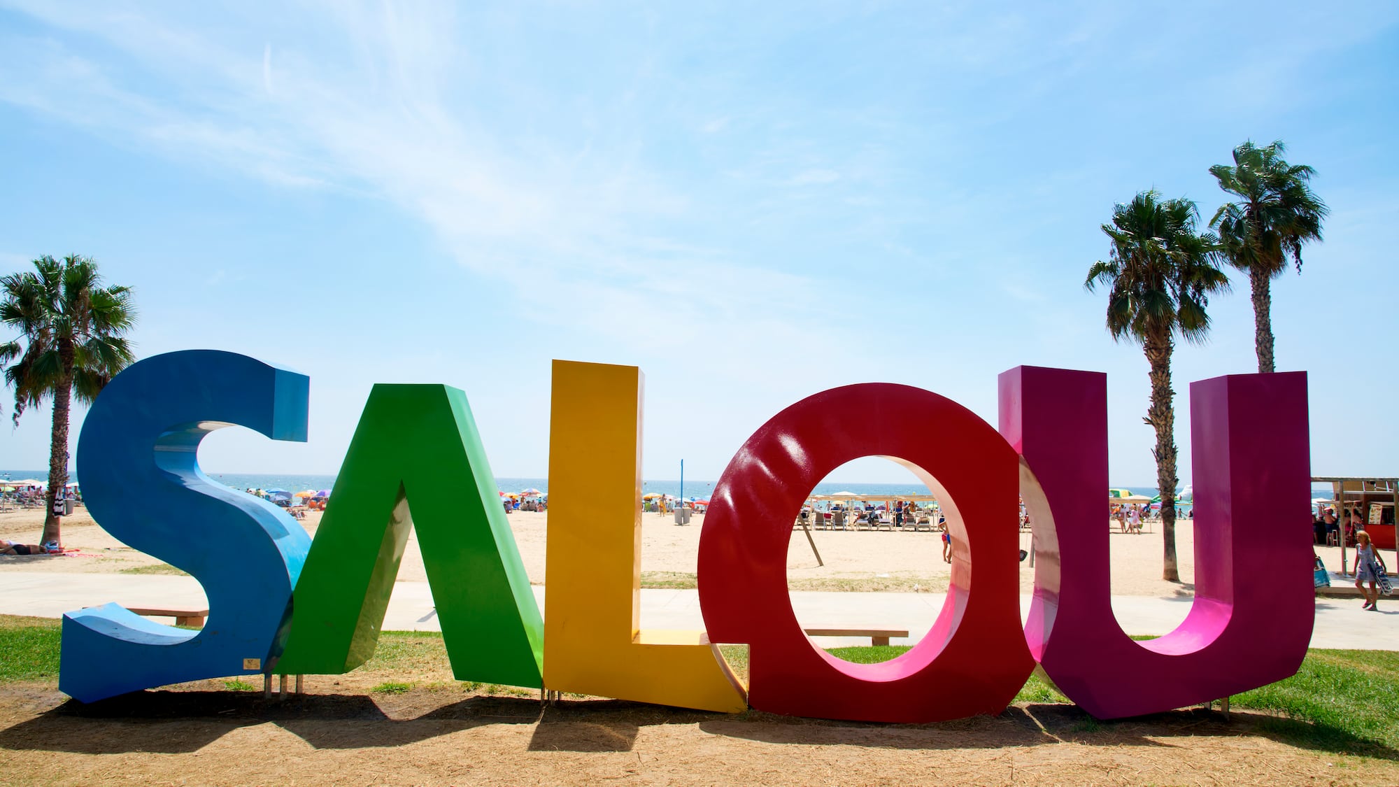 a colorful sign on a beach