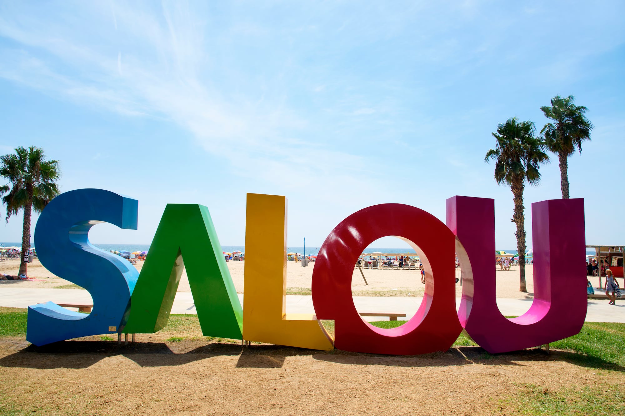 a colorful sign on a beach