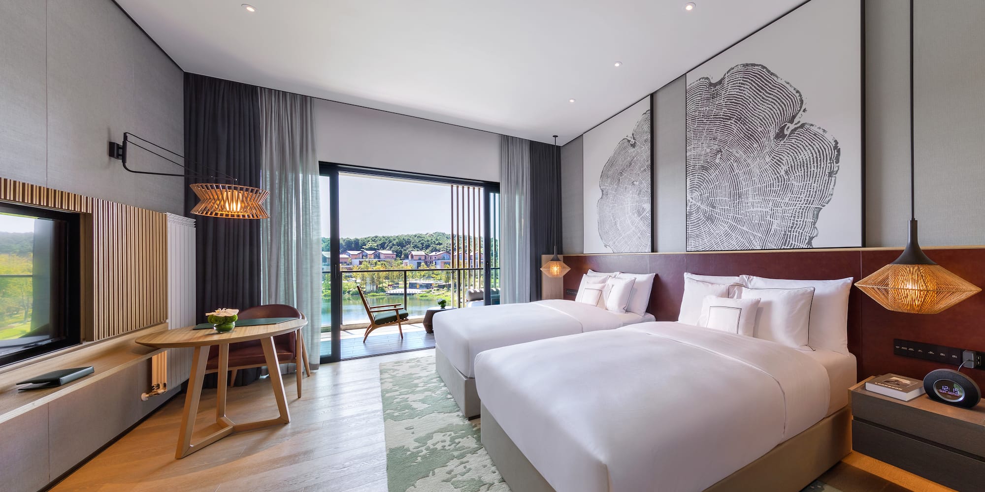 a room with two beds and a table