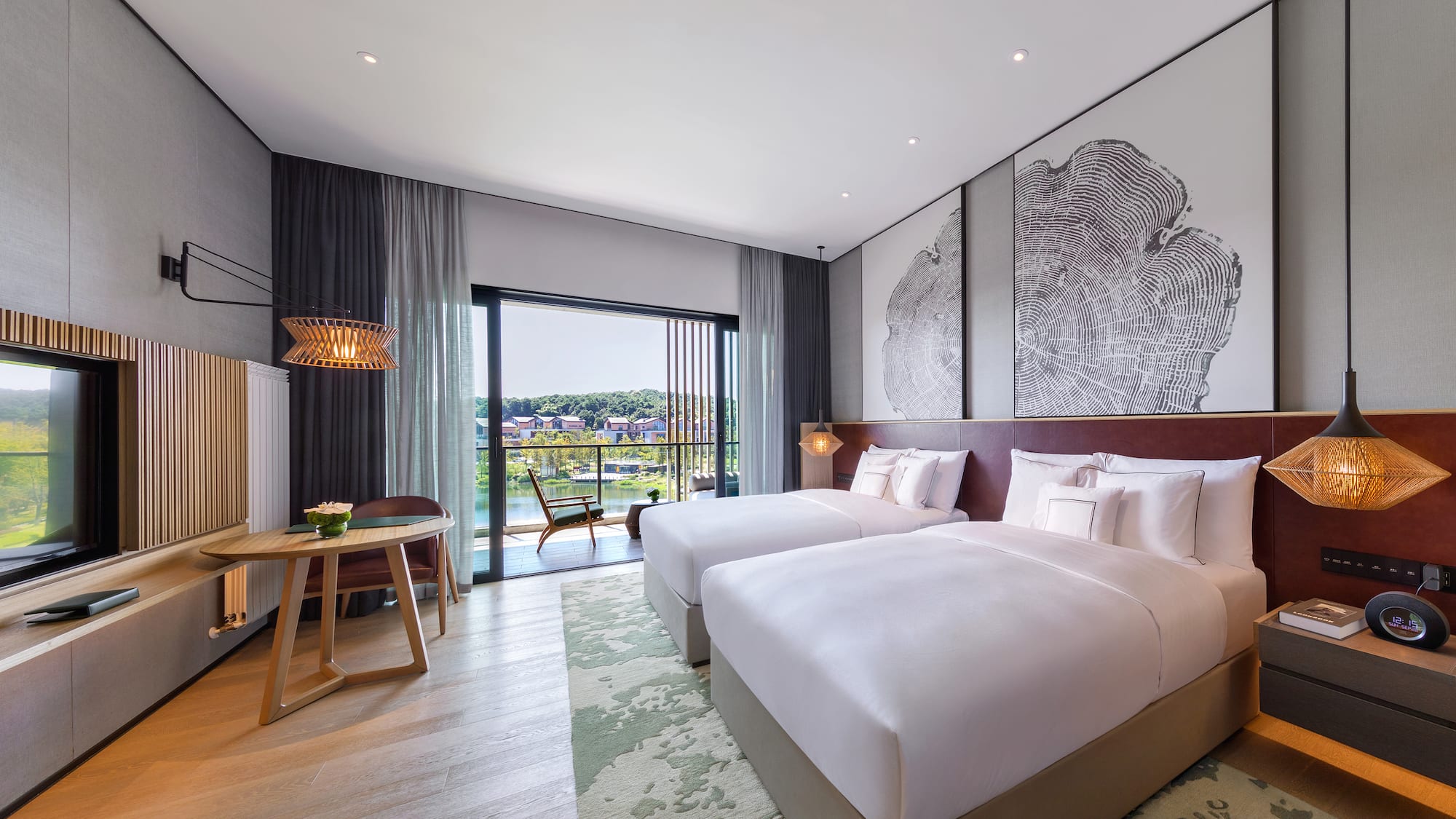 a room with two beds and a table