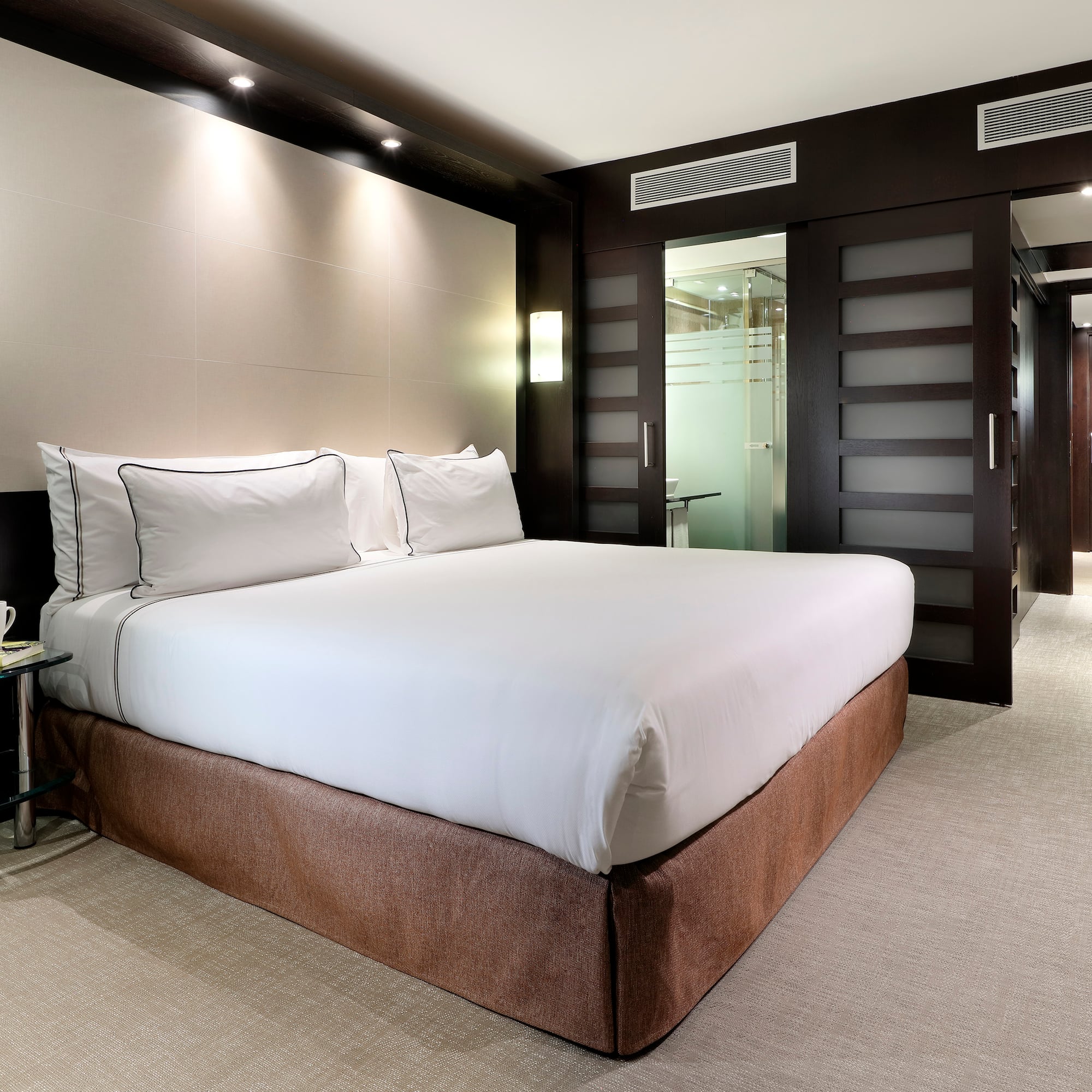 a bed in a hotel room