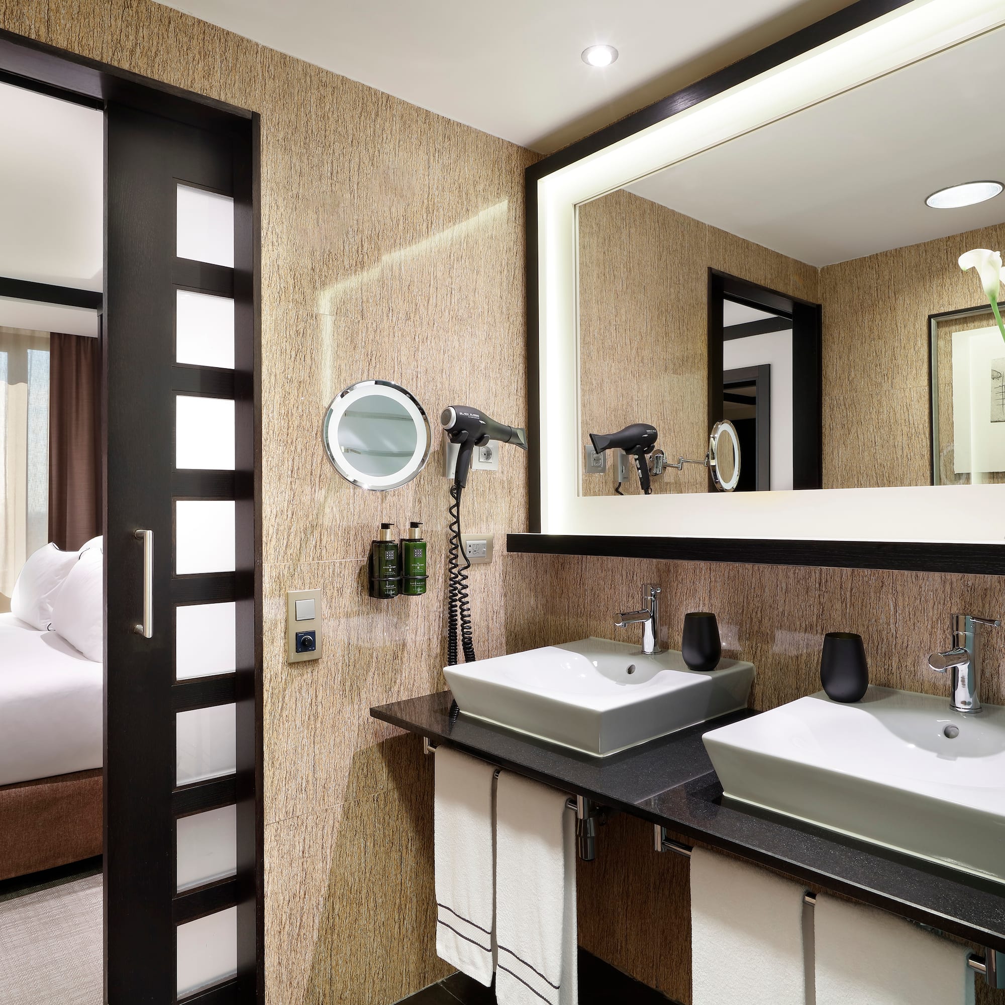 a bathroom with a mirror and sinks