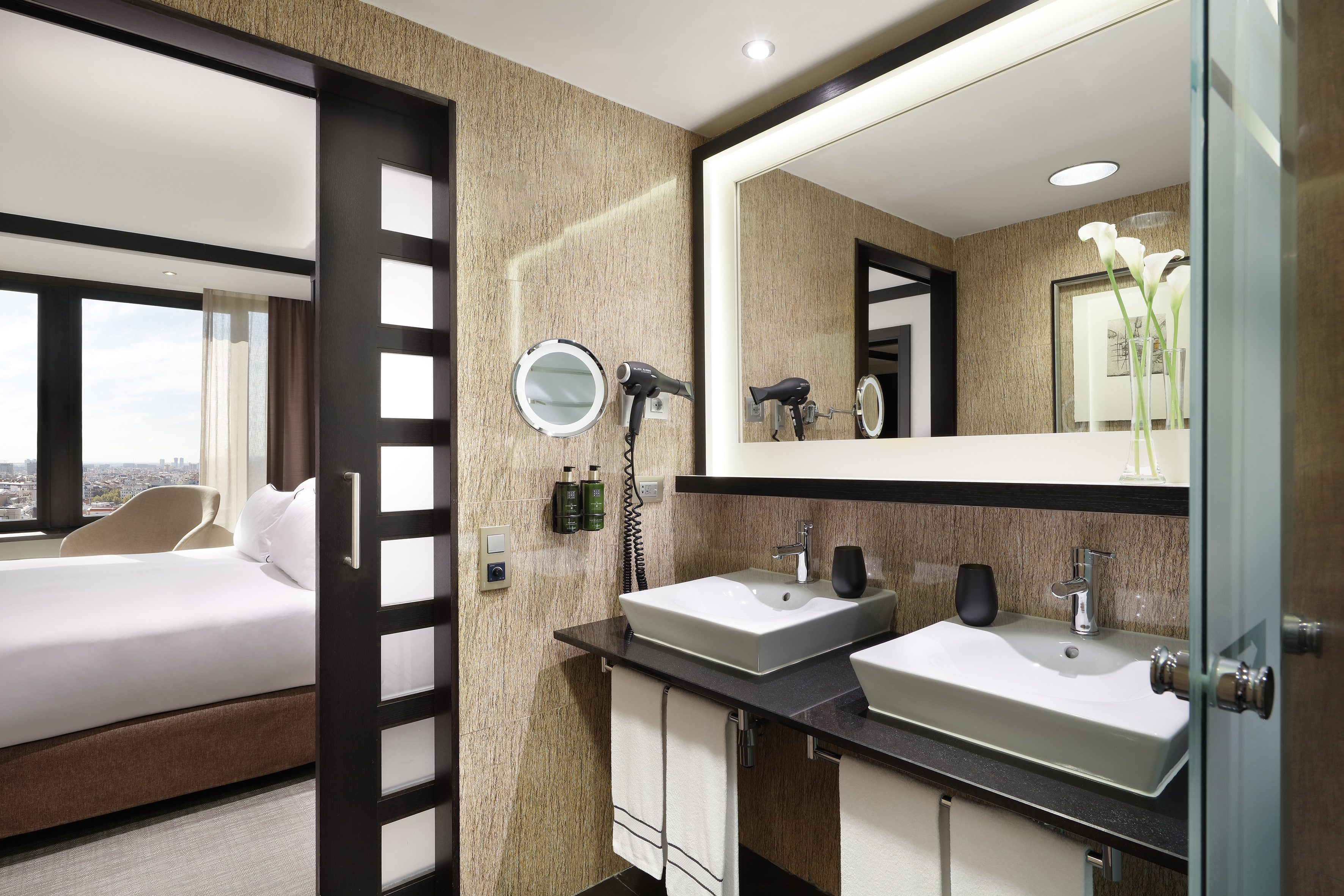 a bathroom with a mirror and sinks