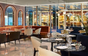 a restaurant with tables and chairs