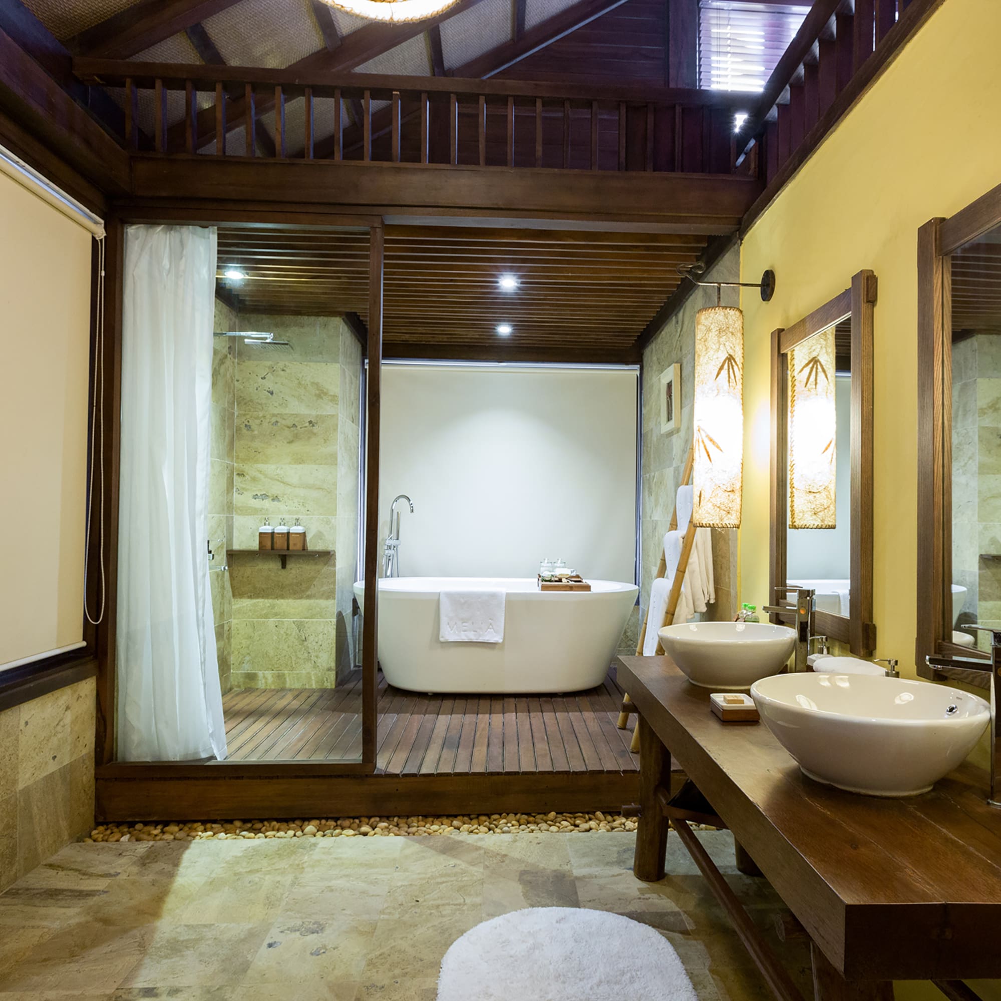 a bathroom with a tub and a shower