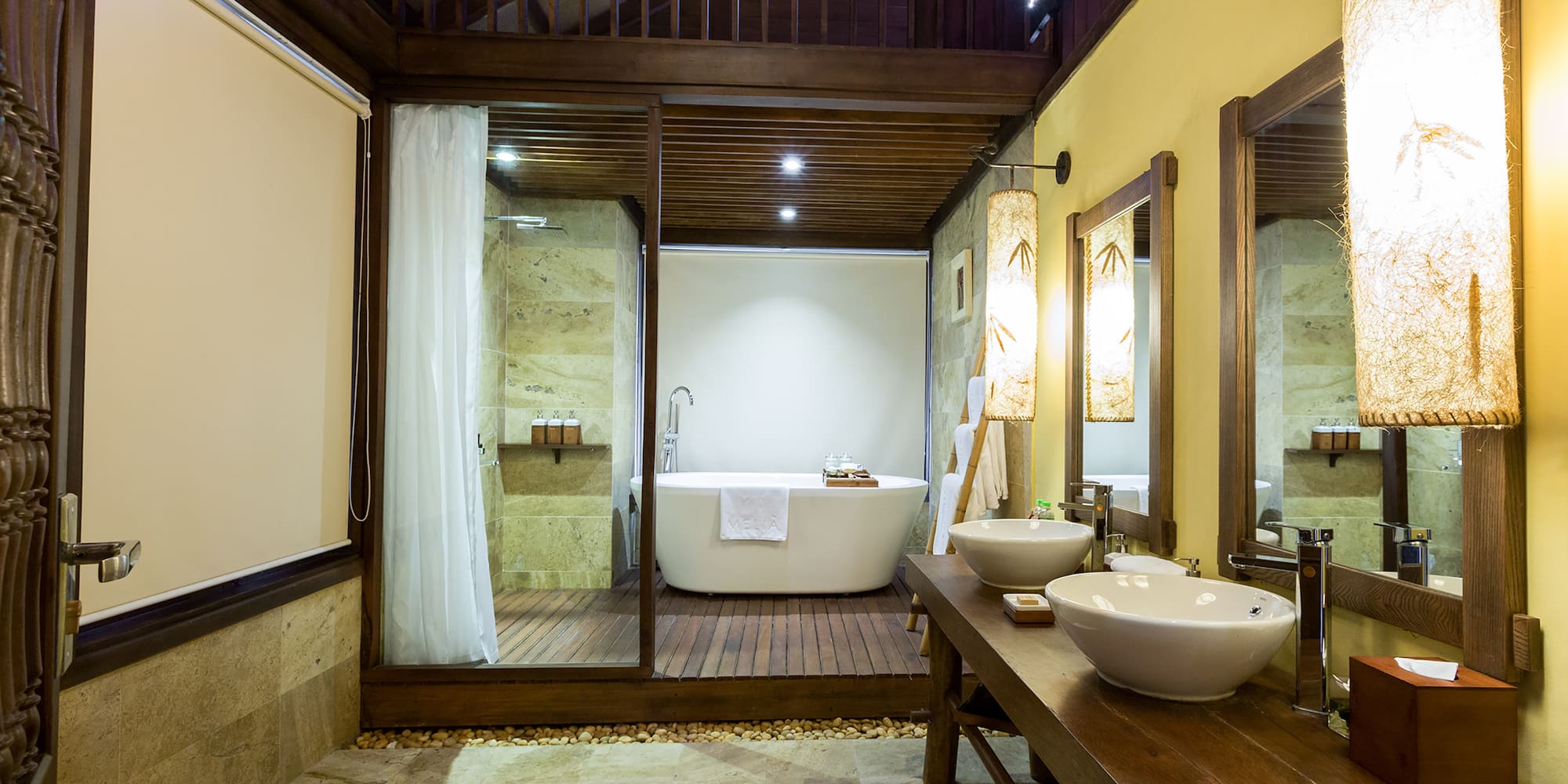 a bathroom with a tub and a shower