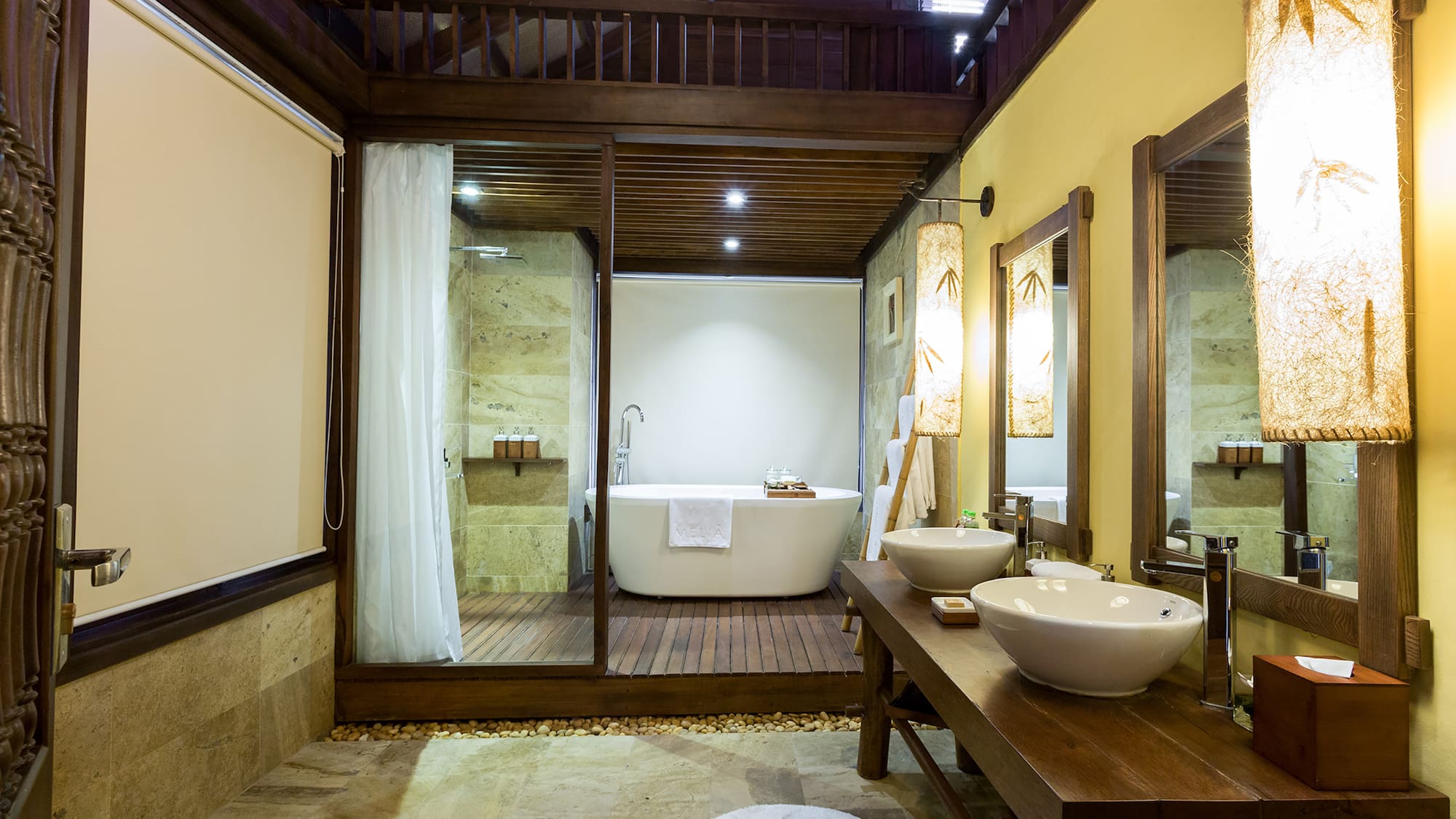 a bathroom with a tub and a shower