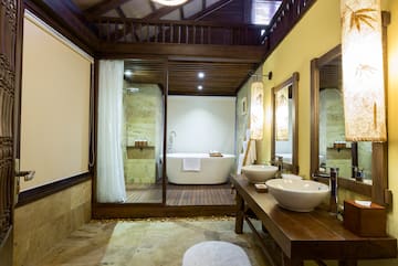 a bathroom with a tub and a shower