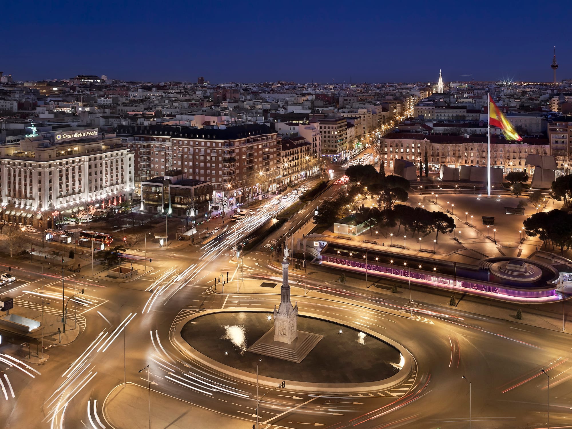 A city featuring a monument surrounded by a network of roads.