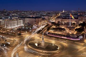 a city with a monument and a circle of roads