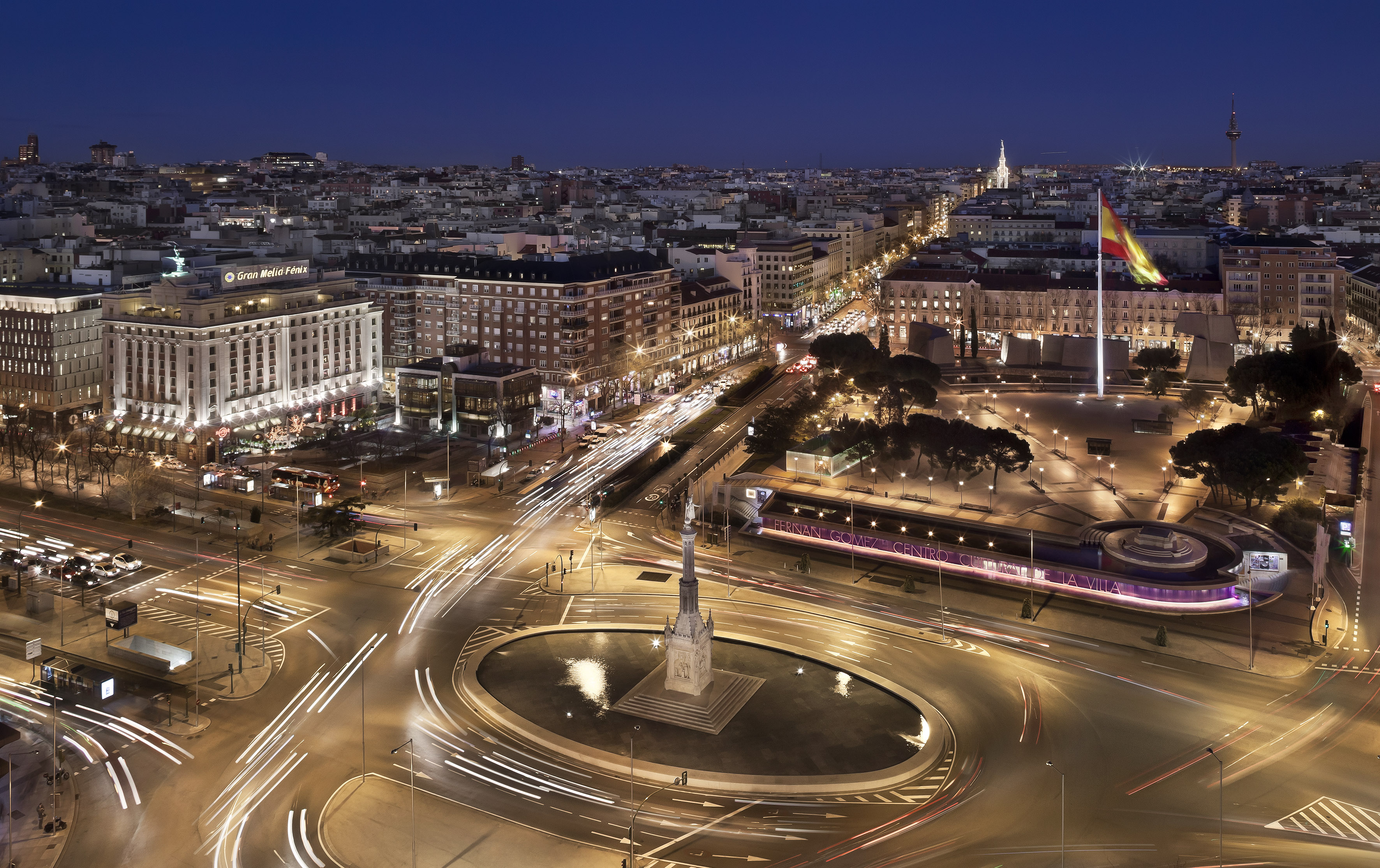 A city featuring a monument surrounded by a network of roads.