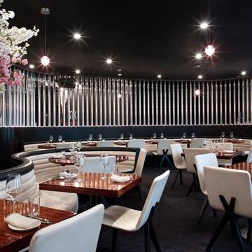 a restaurant with tables and chairs