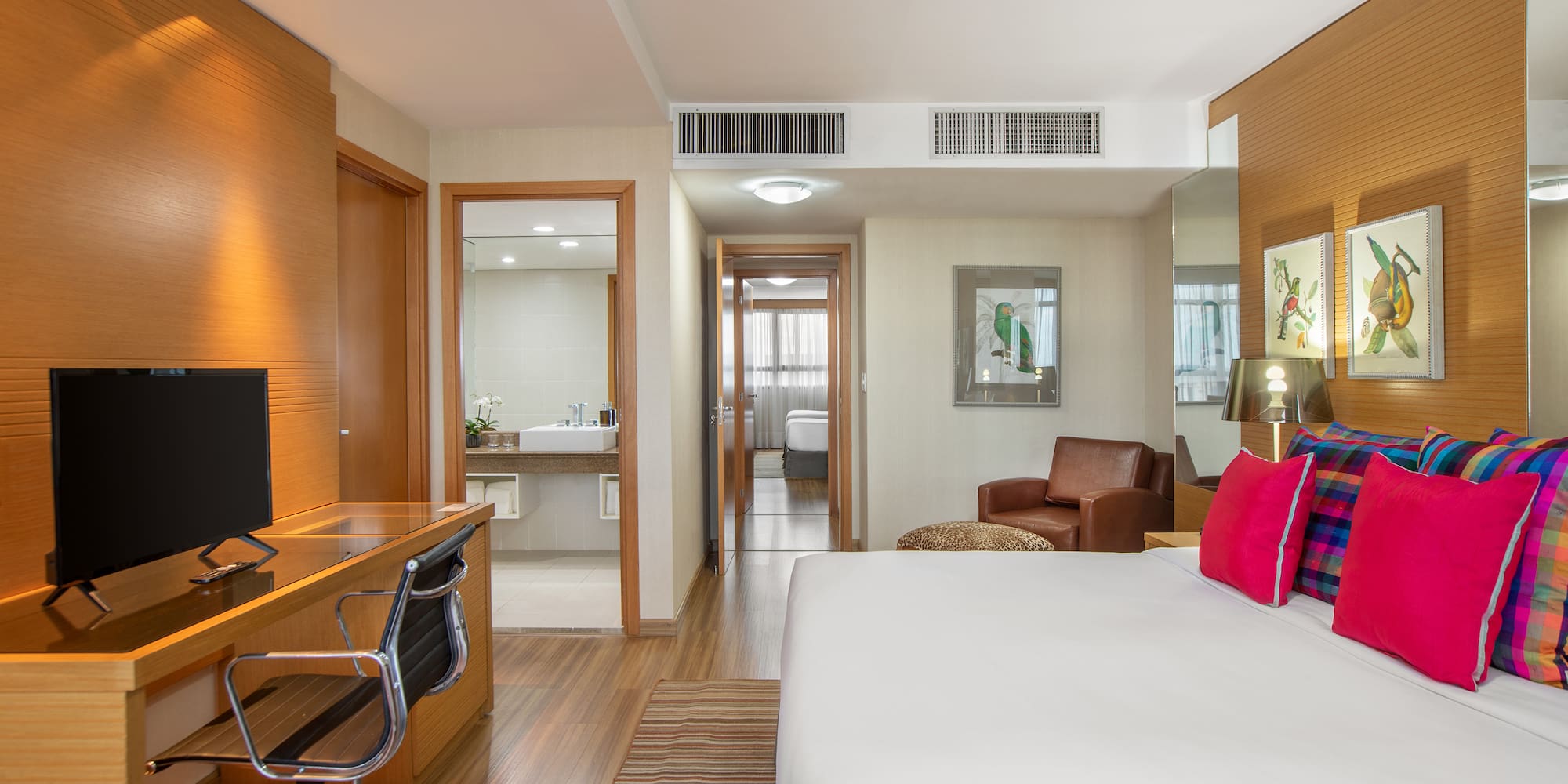 a room with a bed and a desk