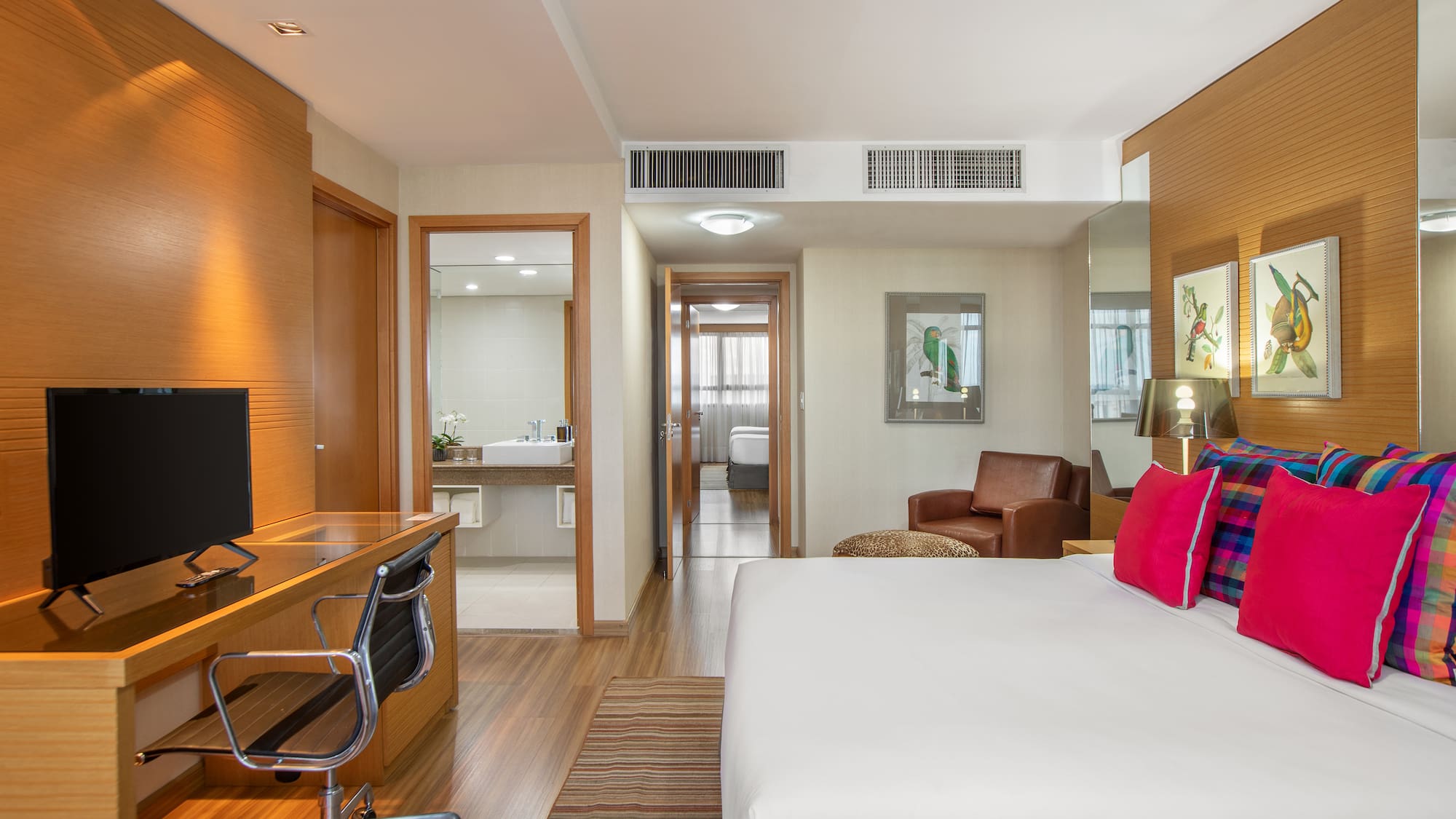 a room with a bed and a desk