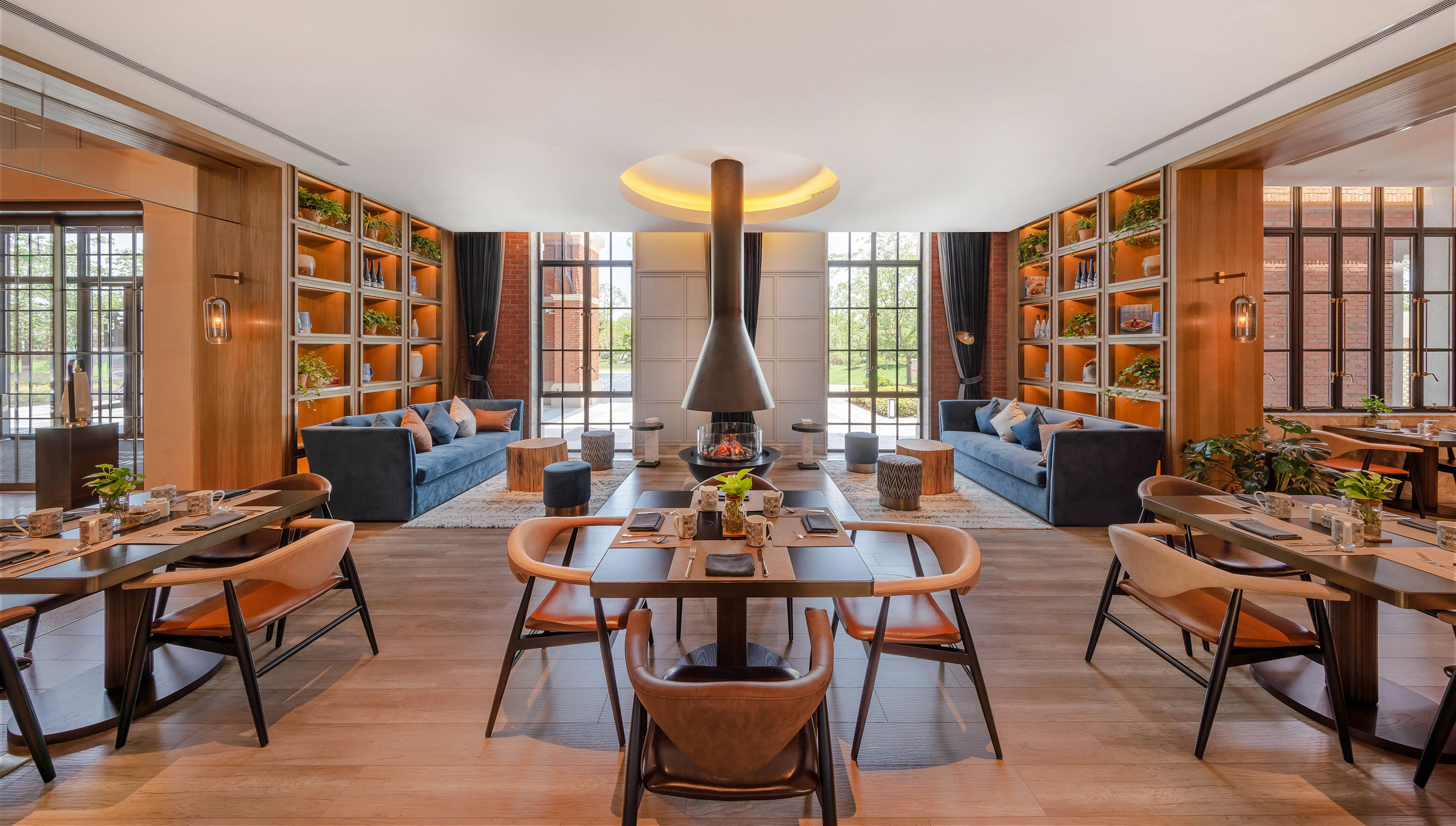 Upscale restaurant interior with modern fireplace, dining and lounge areas.