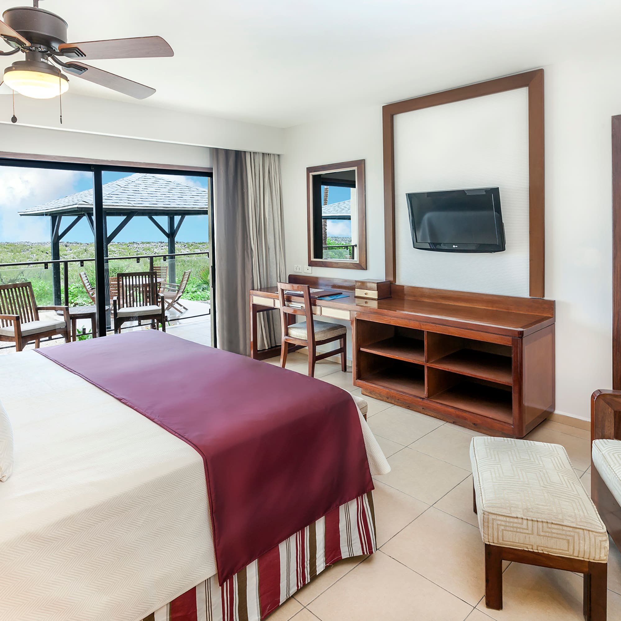 a room with a bed and a television