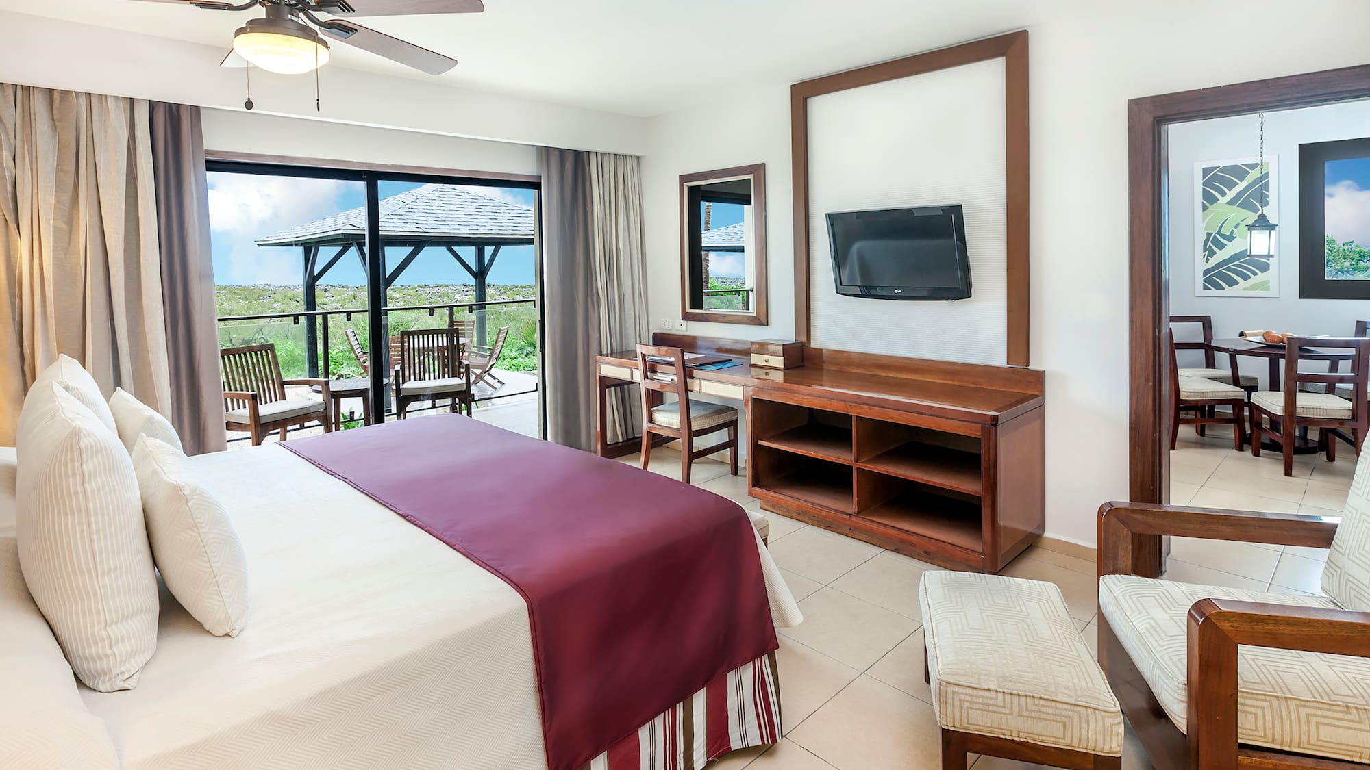 a room with a bed and a television